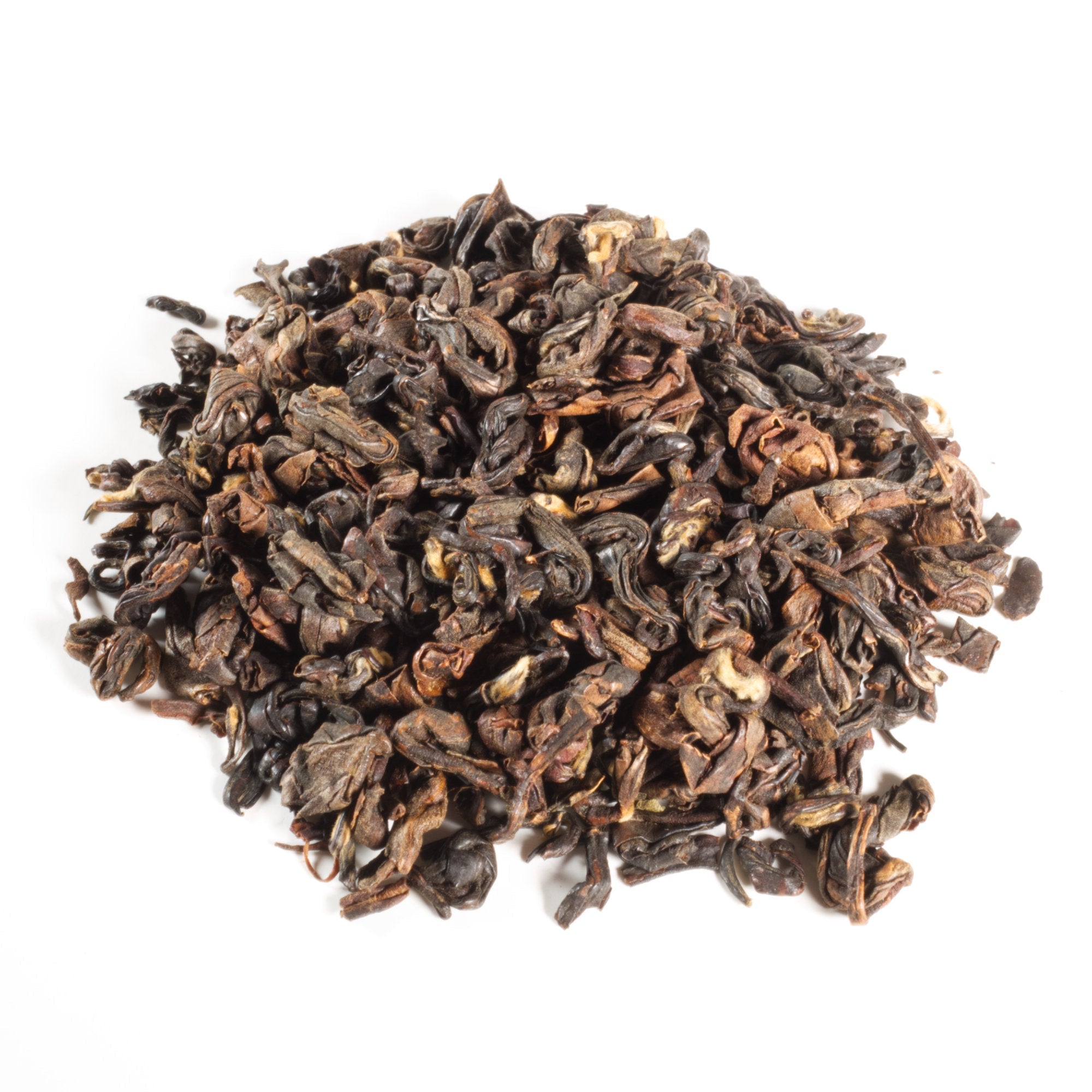 Dry black tea leaves on a white background