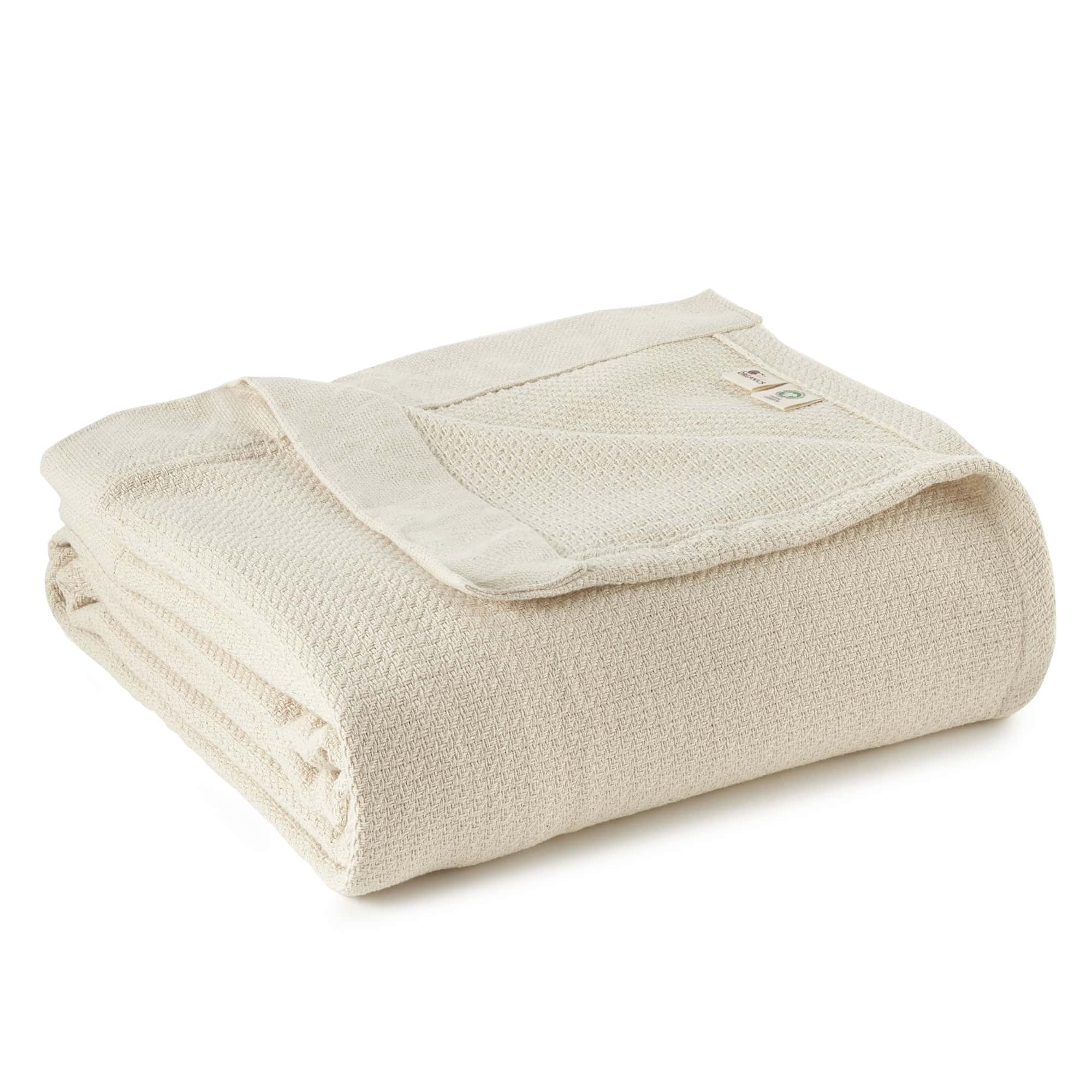 Folded beige blanket on a white background