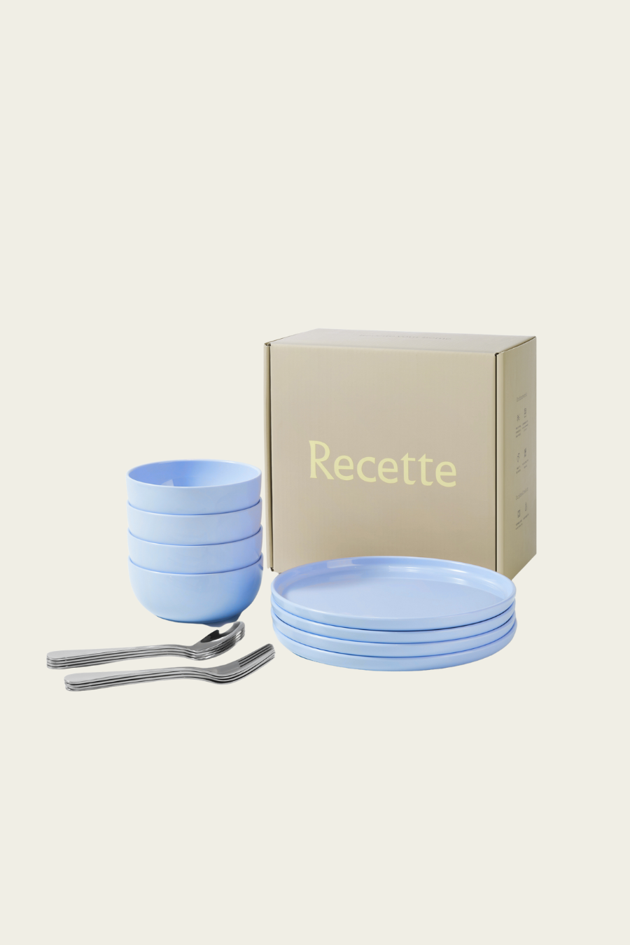 Set of blue ceramic bowls, cups, and spoons with a 'Recette' branded box on a white background.