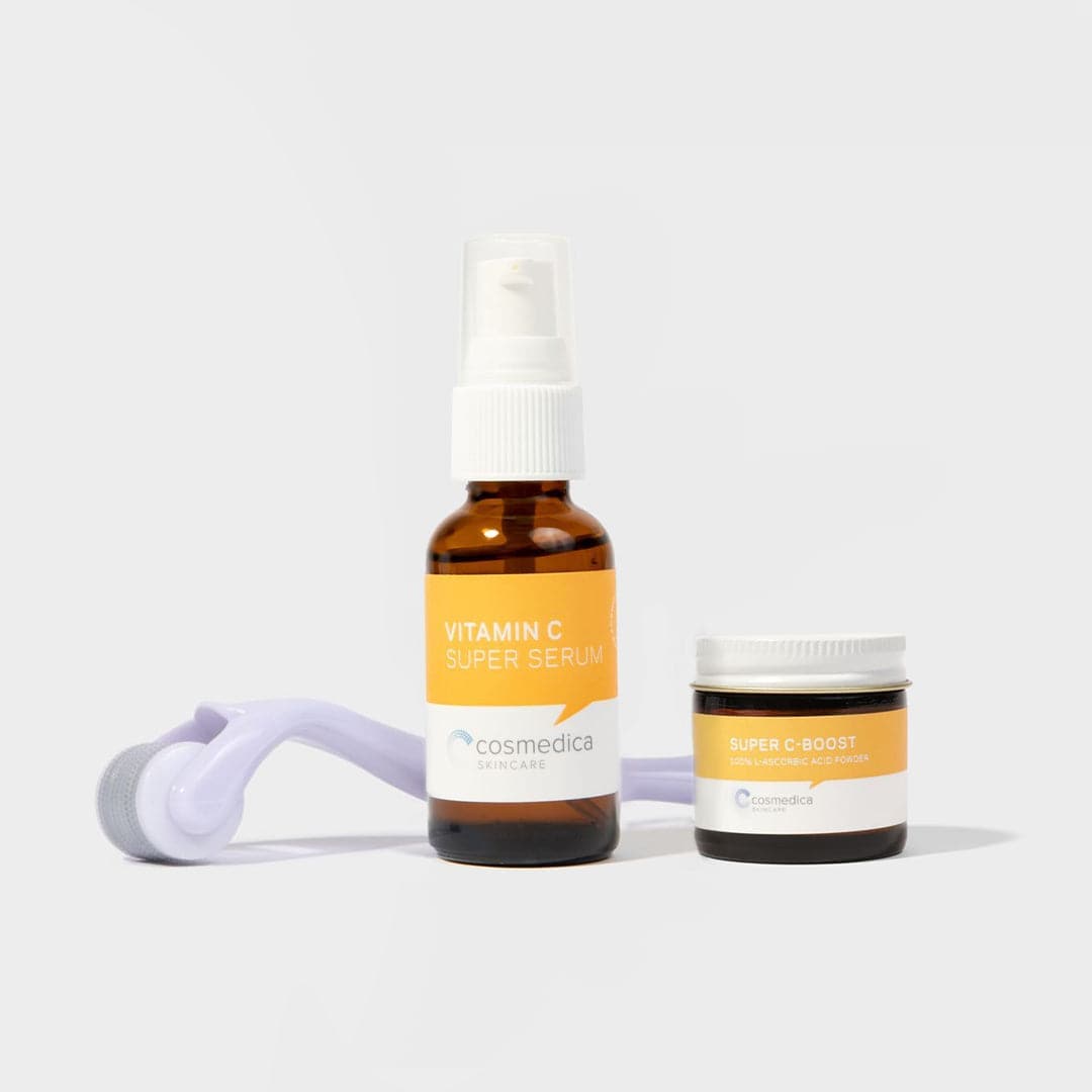 Cosmedica Vitamin C serum bottle and jar with roller on a white background
