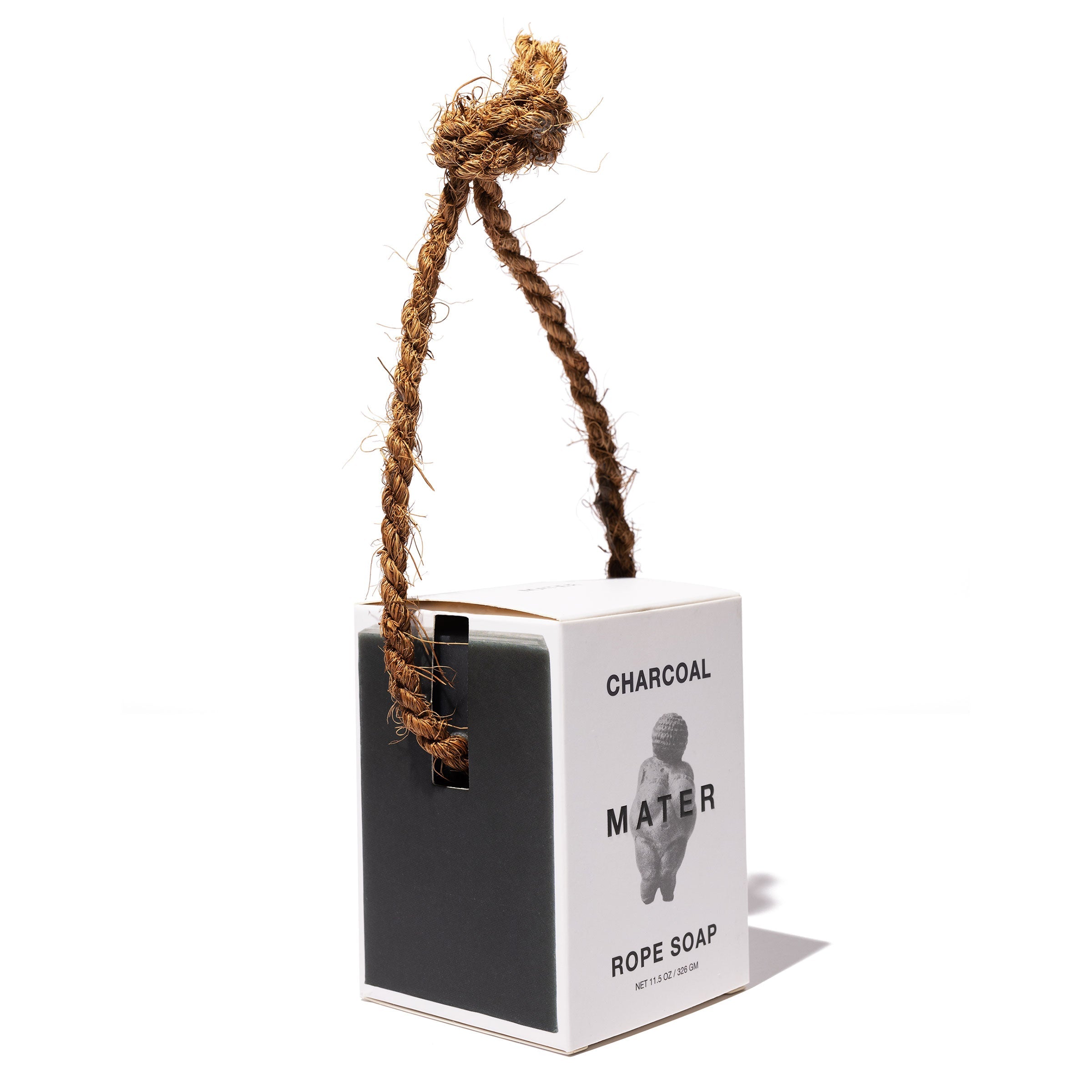 Charcoal rope soap with packaging on a white background