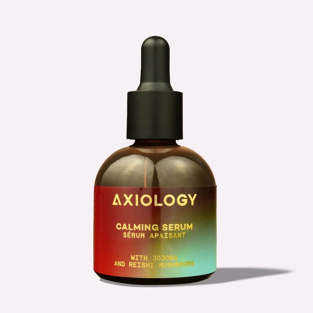 Axiology calming serum bottle with dropper on a white background