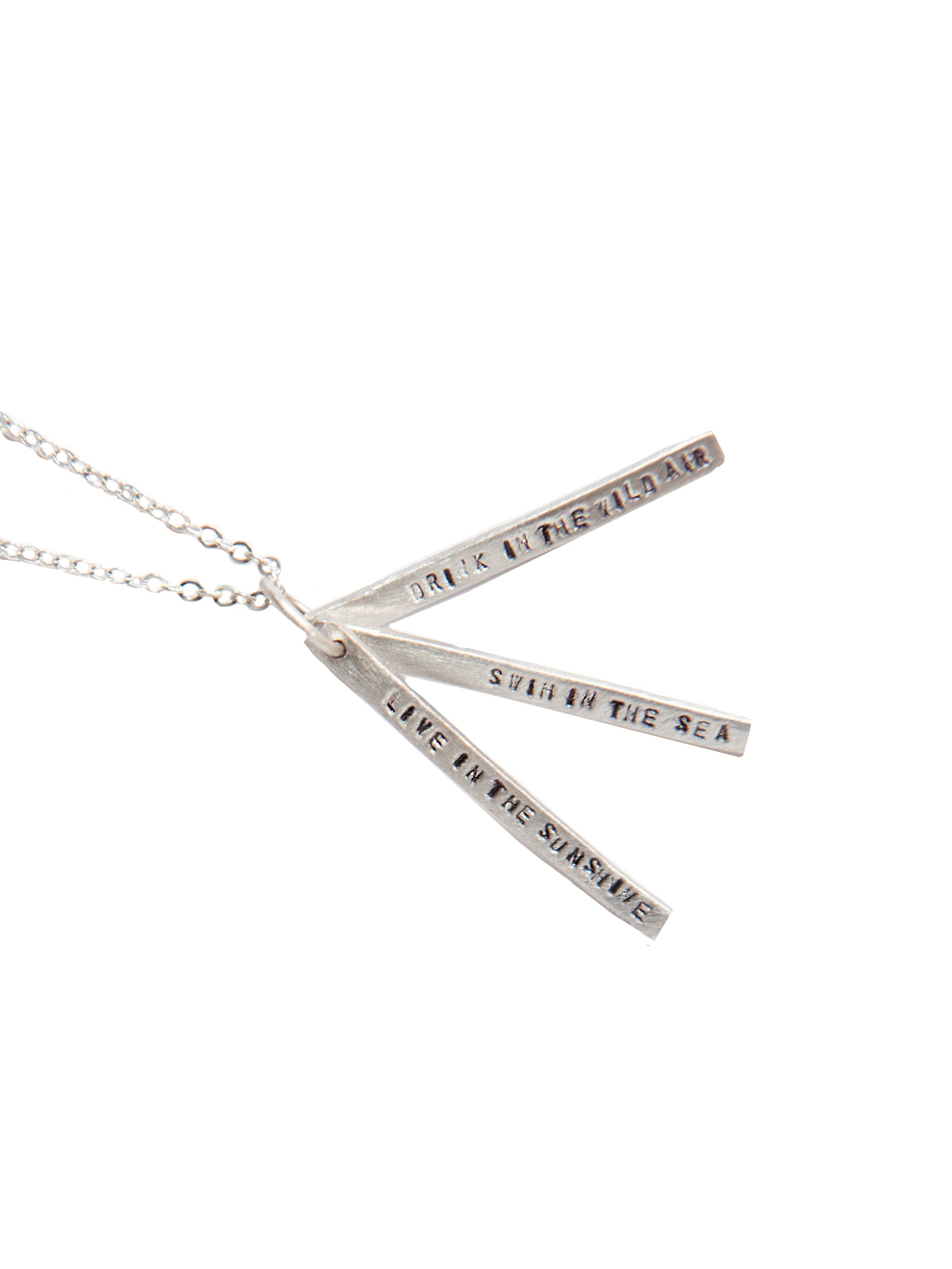 Silver necklace with three engraved bars on a white background