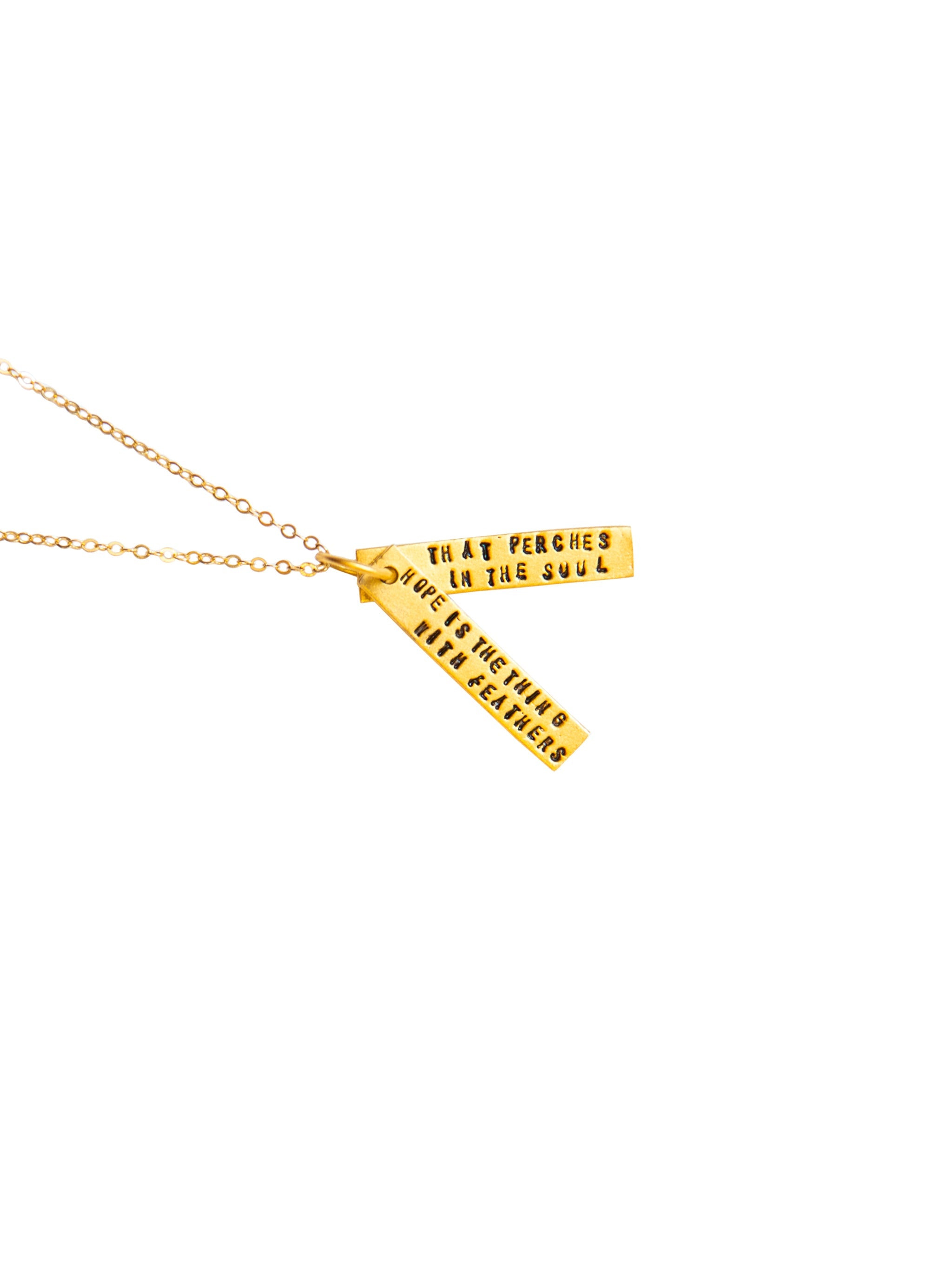 Gold necklace with engraved text on a white background