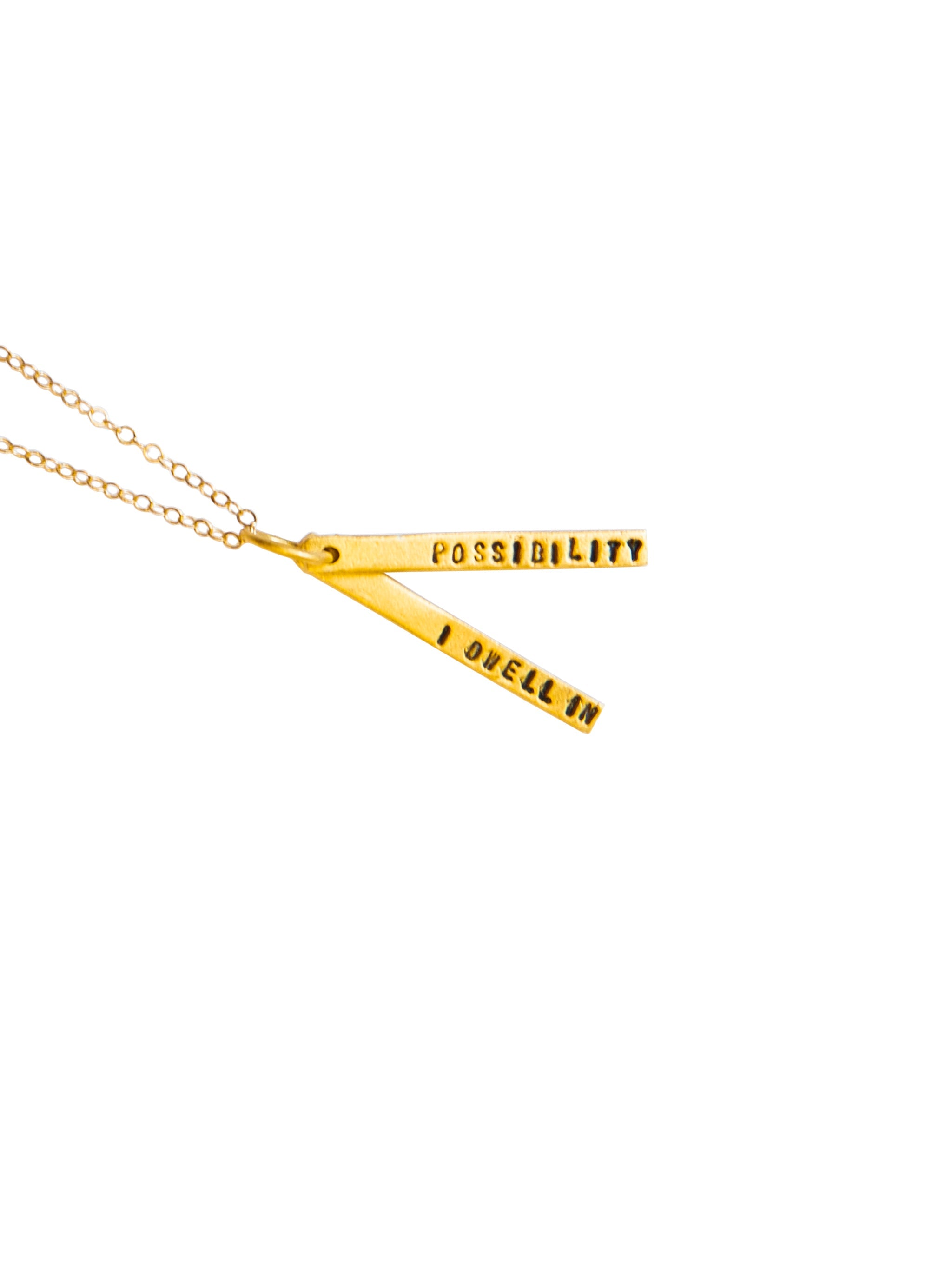 Gold necklace with triangular pendants on a white background