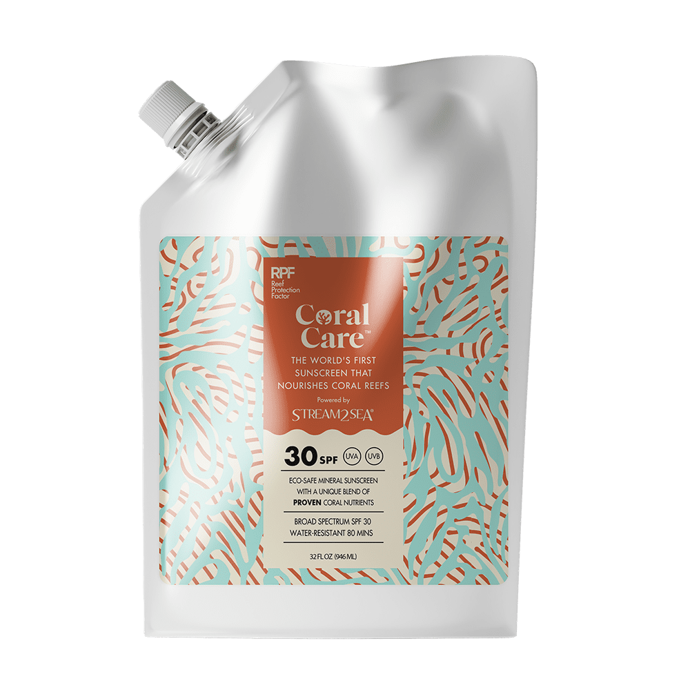 Coral Care sunscreen packaging on a green background