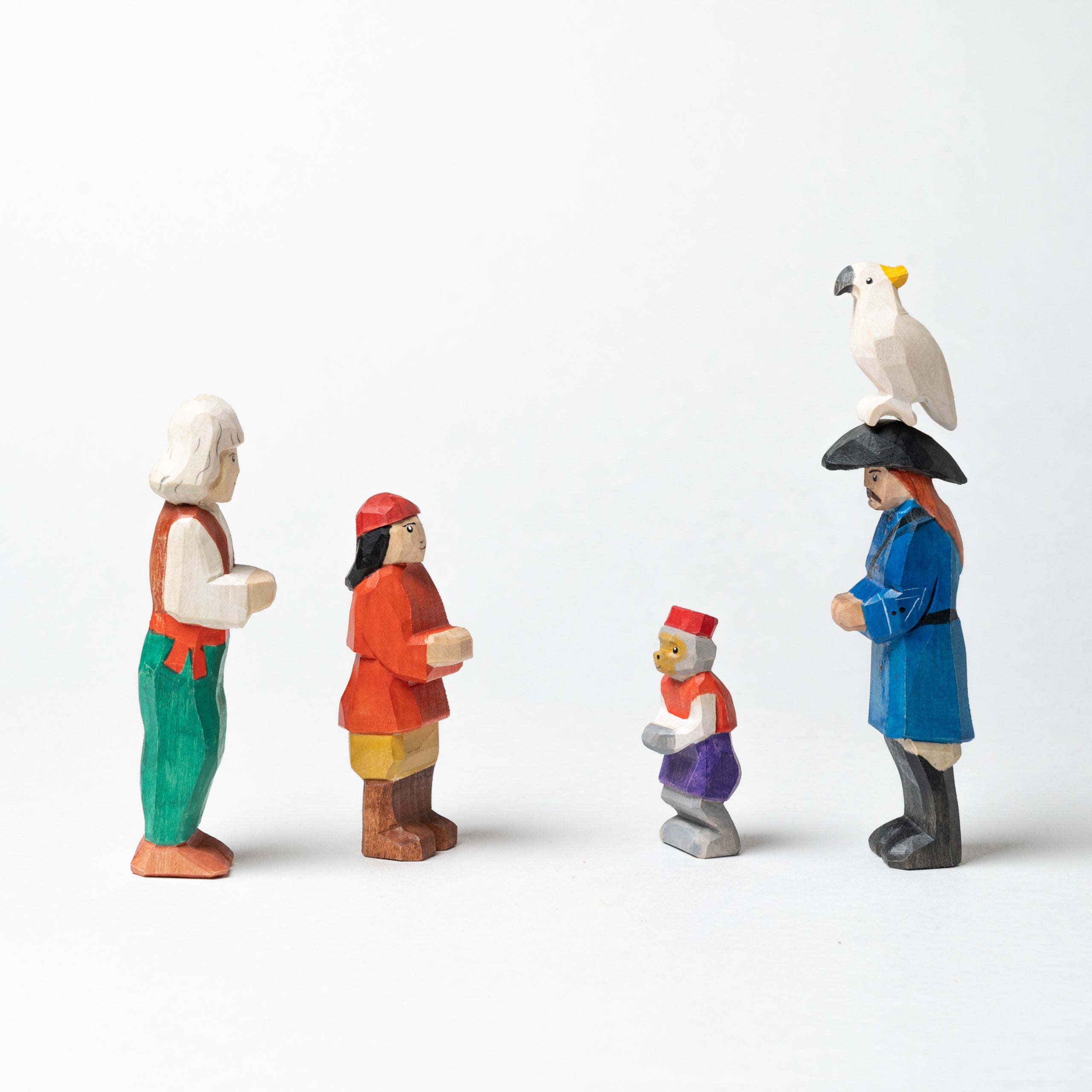 Set of colorful figurines on a white background