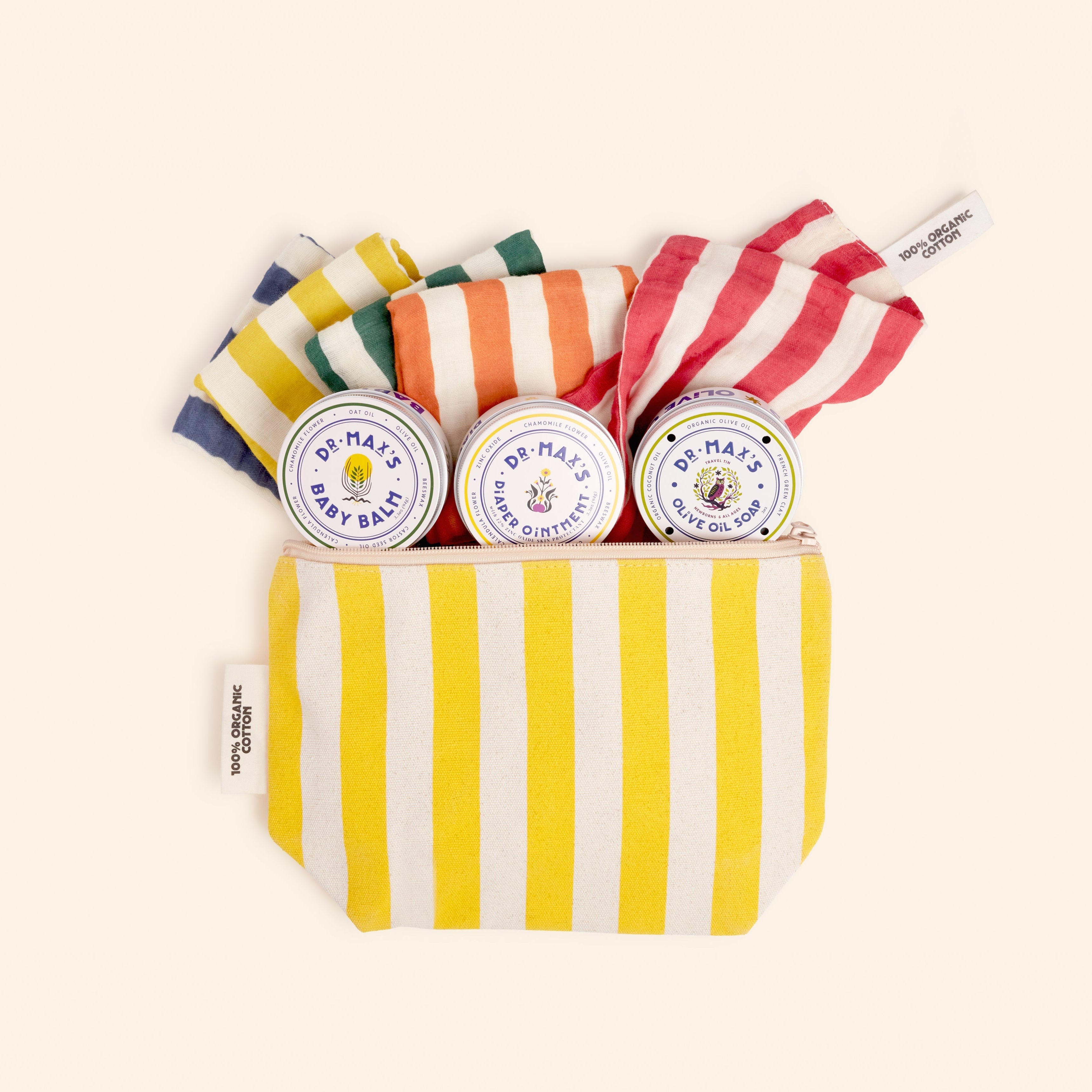 Striped pouch with baby balm containers and colorful striped socks on a white background