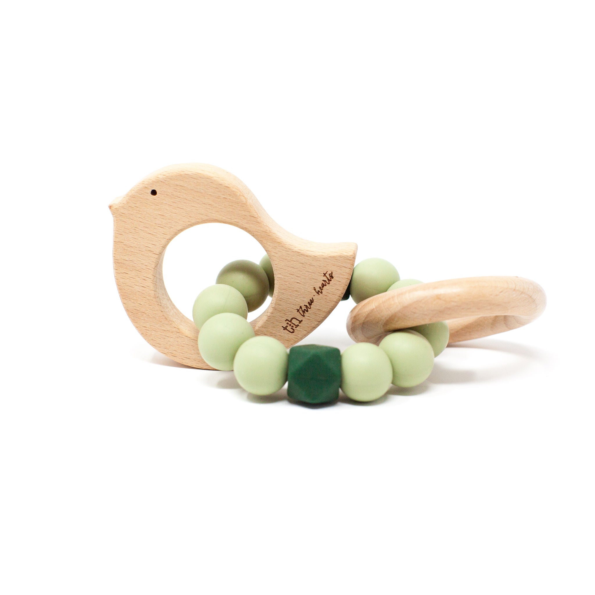 Wooden bird-shaped teething ring with green beads on a white background