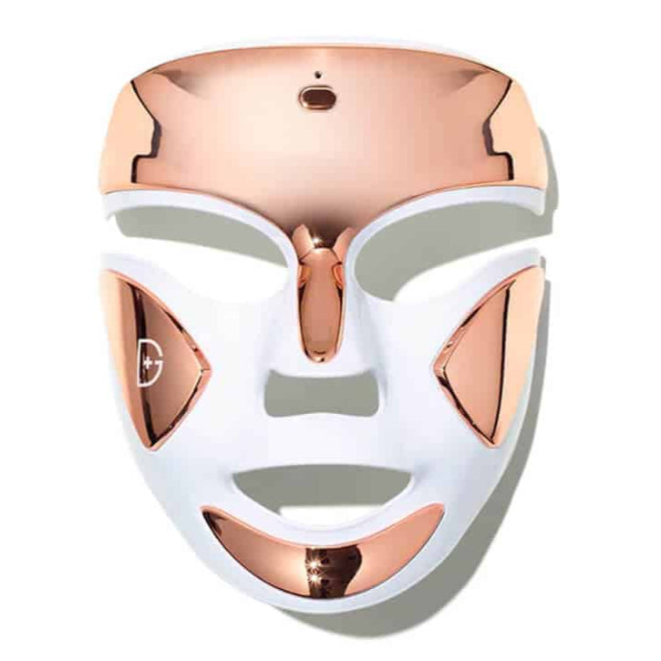 White and rose gold facial mask on a white background