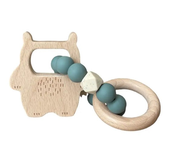 Wooden owl-shaped teething ring with teal beads on a white background