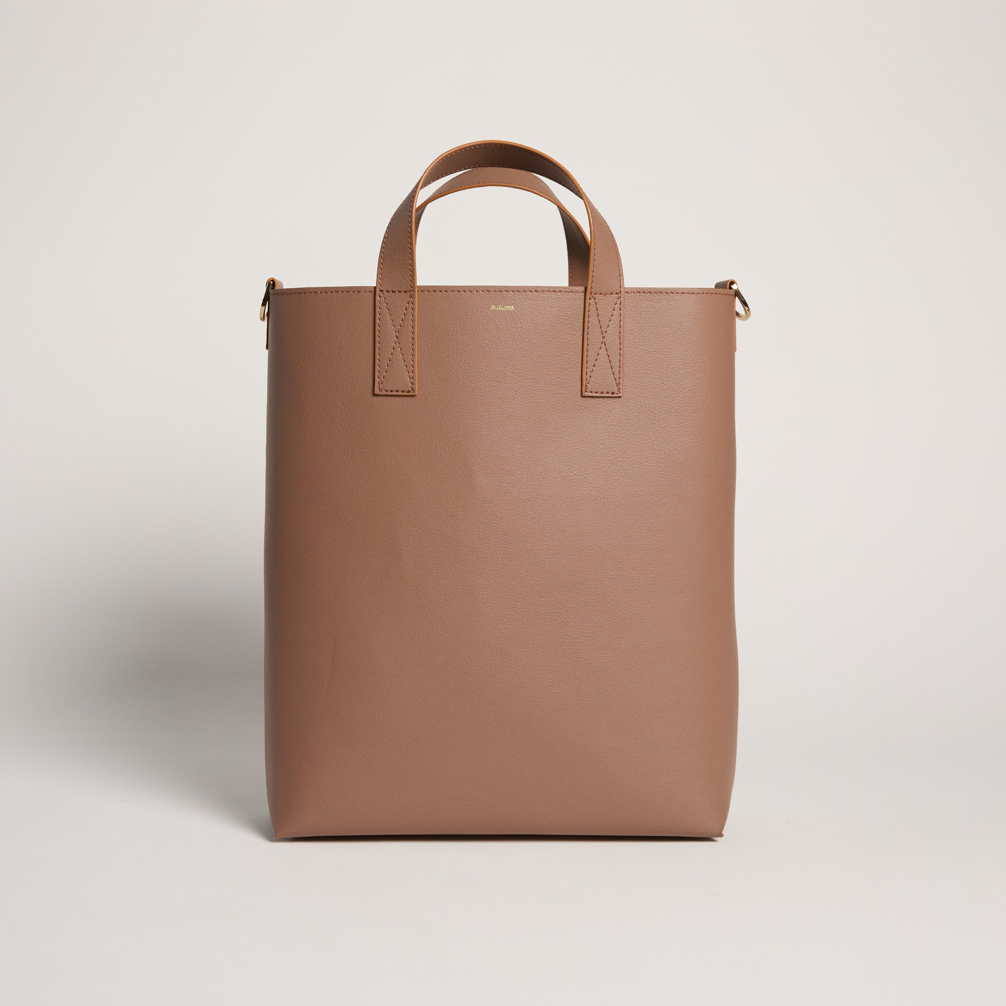 Brown tote bag on a light gray background