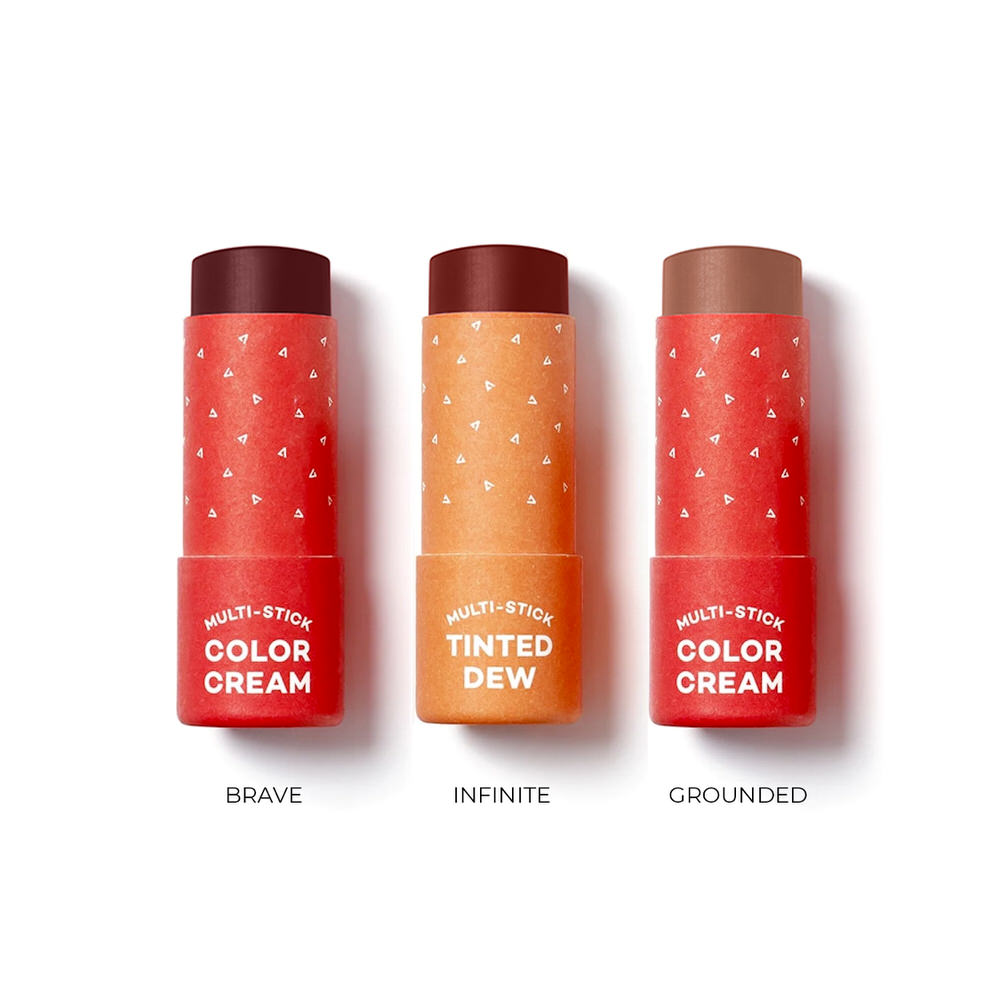 Three red and orange lip balm sticks with labels on a white background