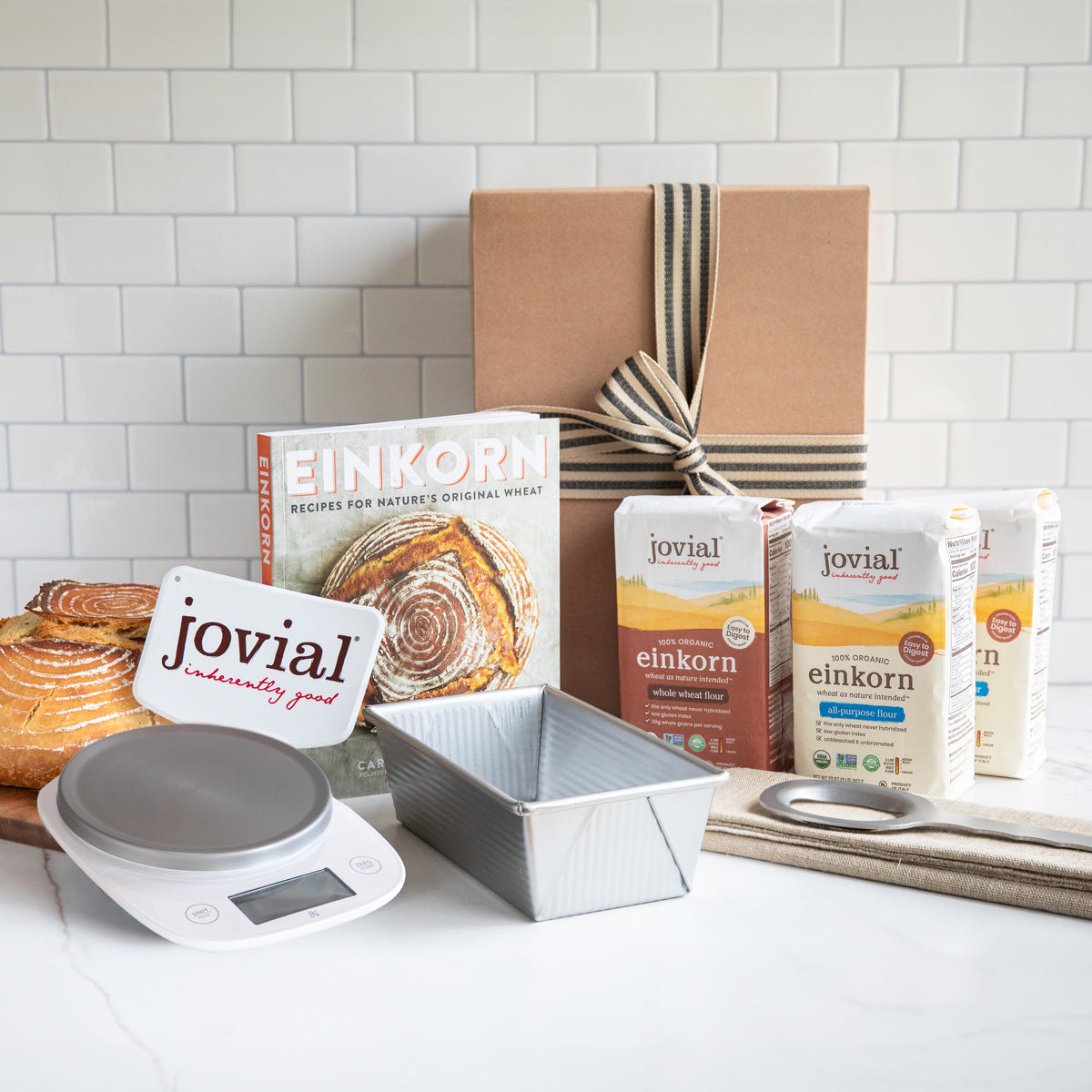 Baking set with Jovial einkorn products on a kitchen counter.