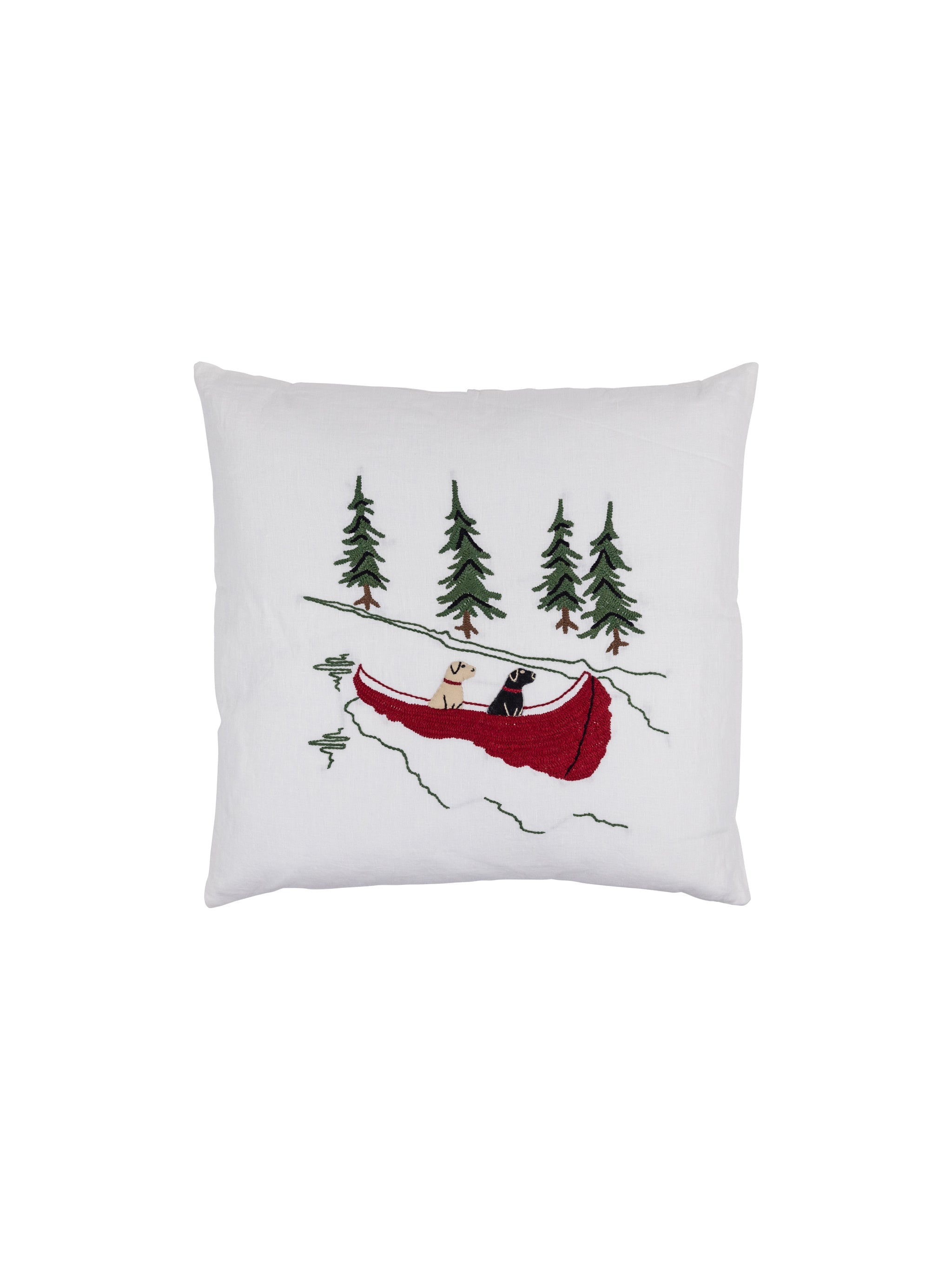 Decorative pillow with a red canoe and trees design on a white background