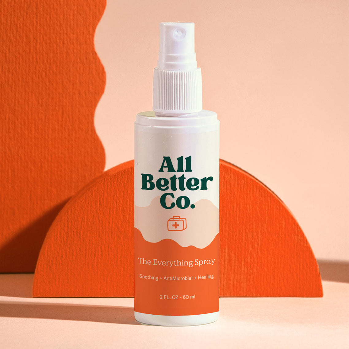 All Better Co. spray bottle on a peach background
