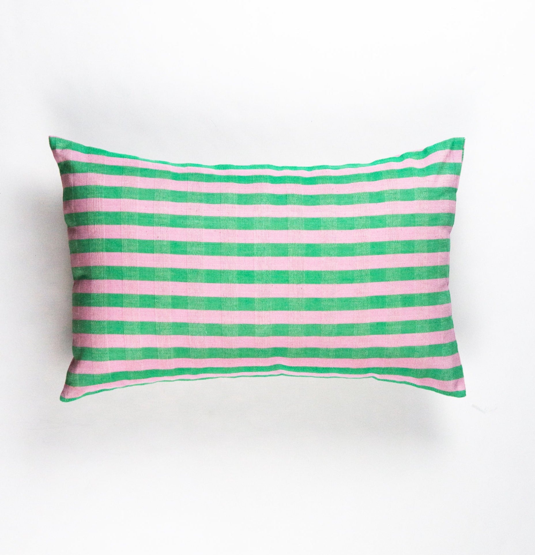 Striped pillow with pink and green horizontal stripes on a white background