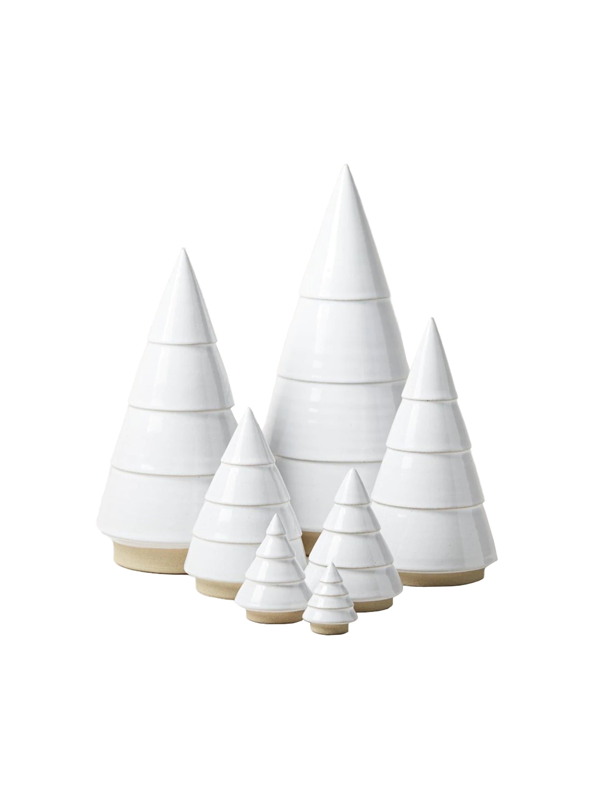 Set of white ceramic Christmas trees on a white background