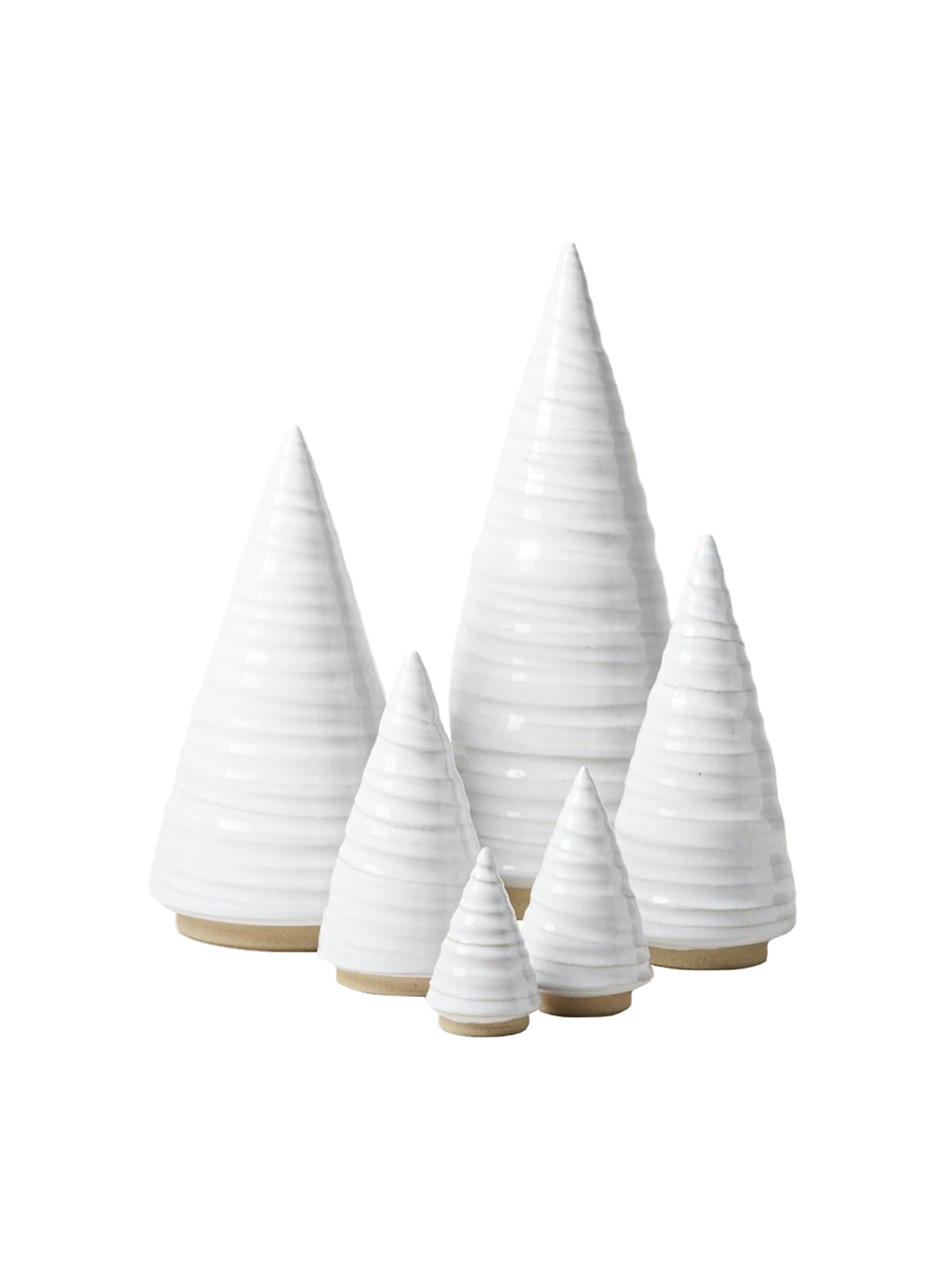 Set of white ceramic Christmas trees on a white background