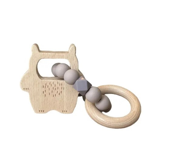 Wooden teething ring with cat design and gray beads on a white background