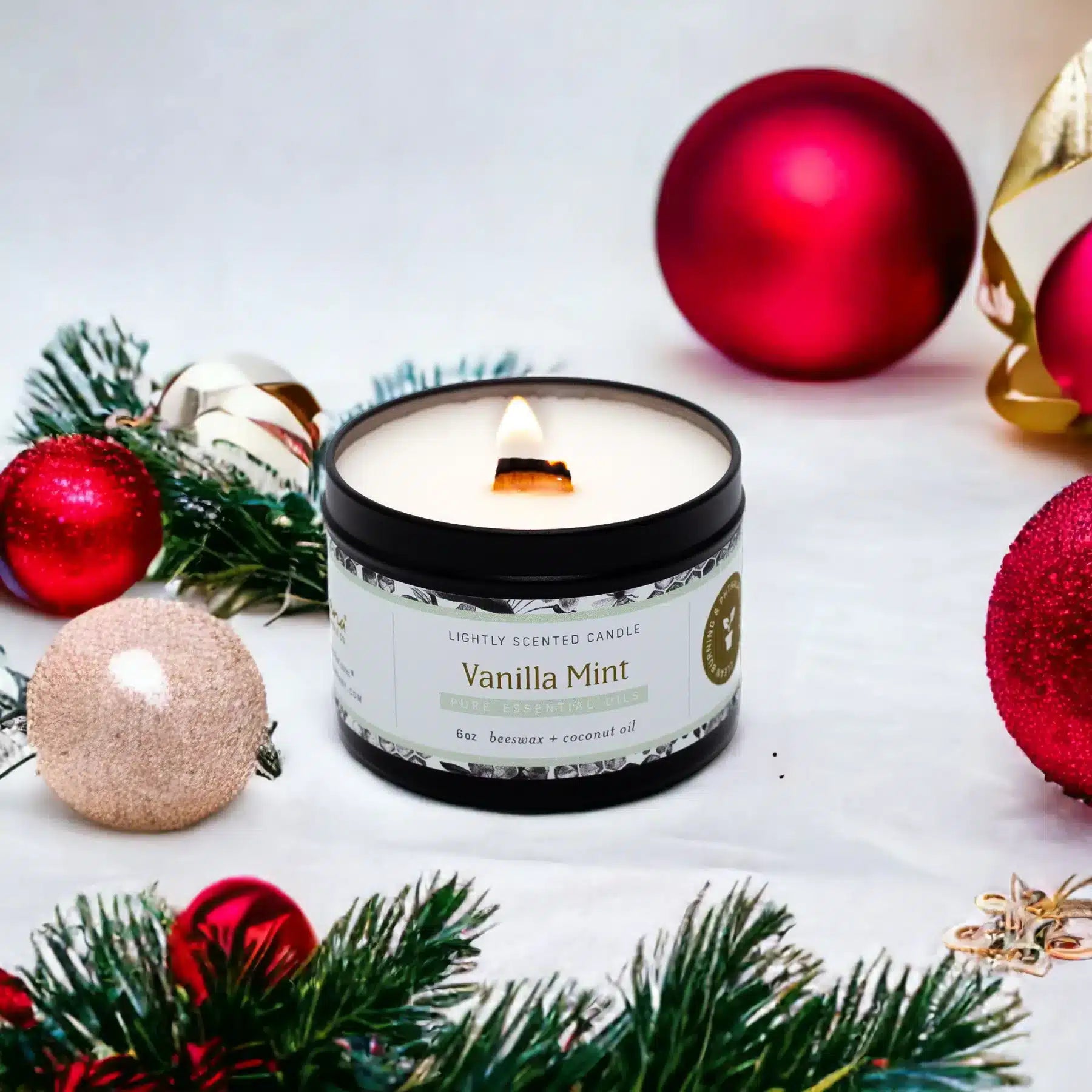 Vanilla Mint candle in a jar with Christmas decorations on a white background
