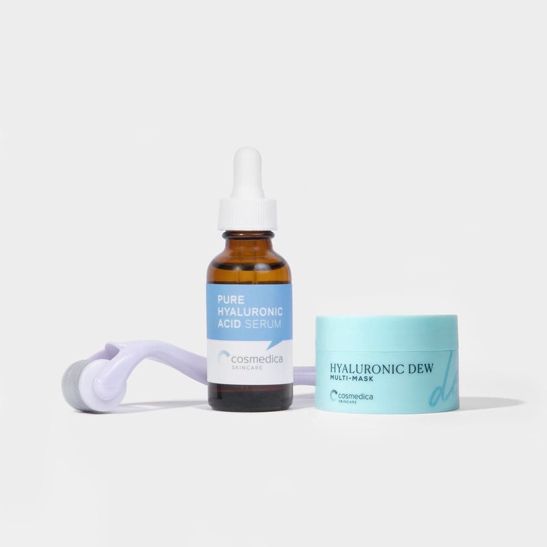 Cosmedica skincare products including a serum bottle and cream on a light gray background