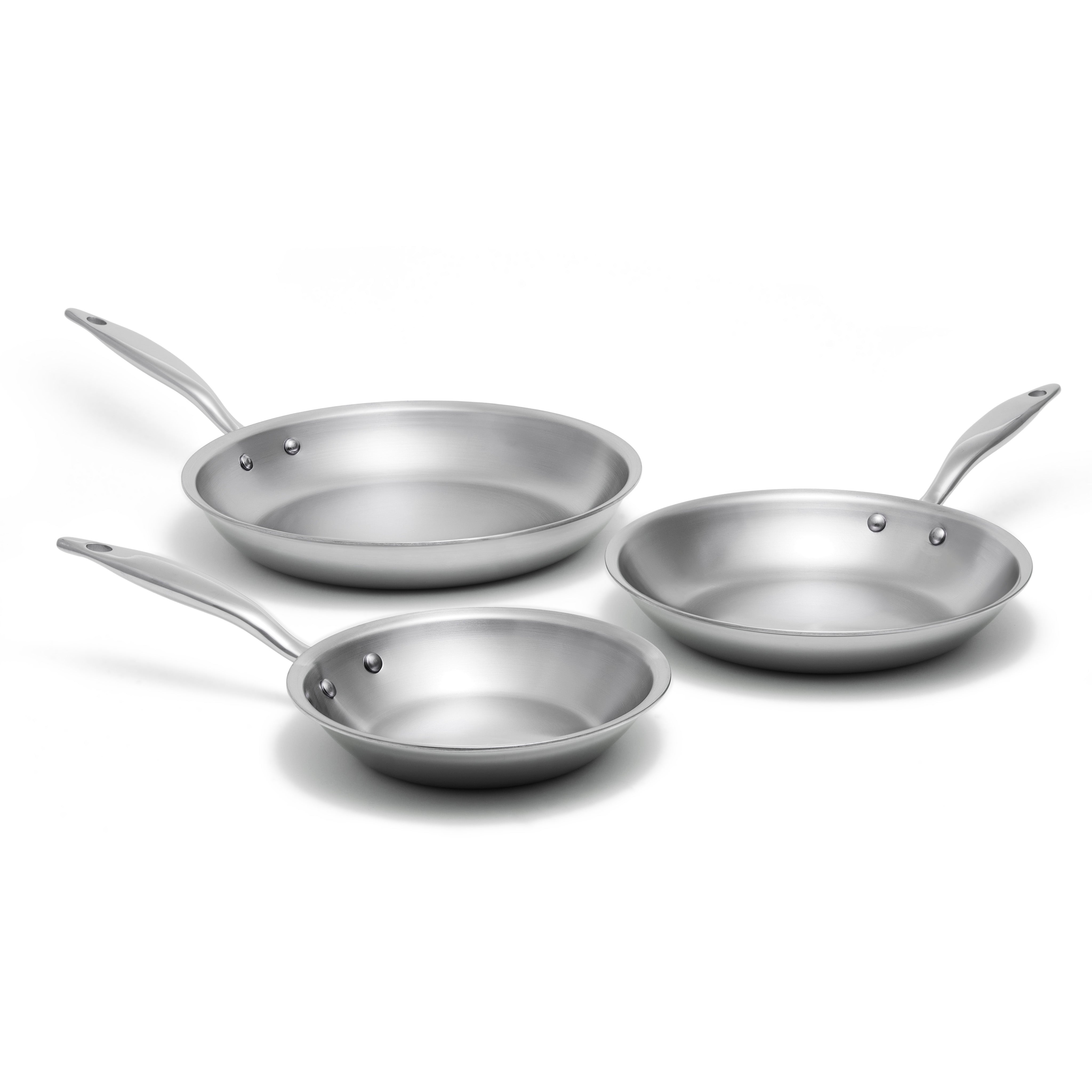 Set of three stainless steel frying pans on a white background