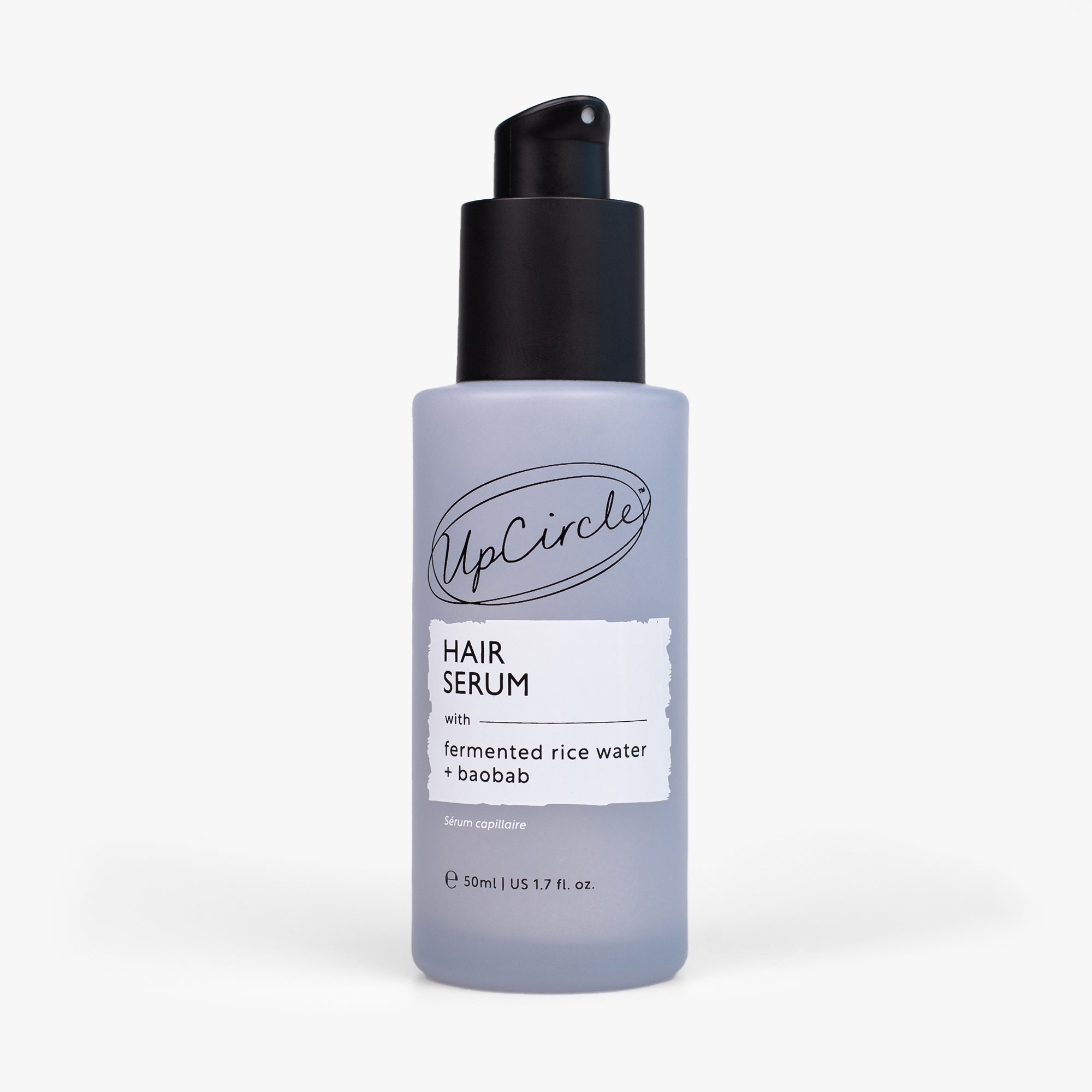 UpCircle hair serum bottle on a white background
