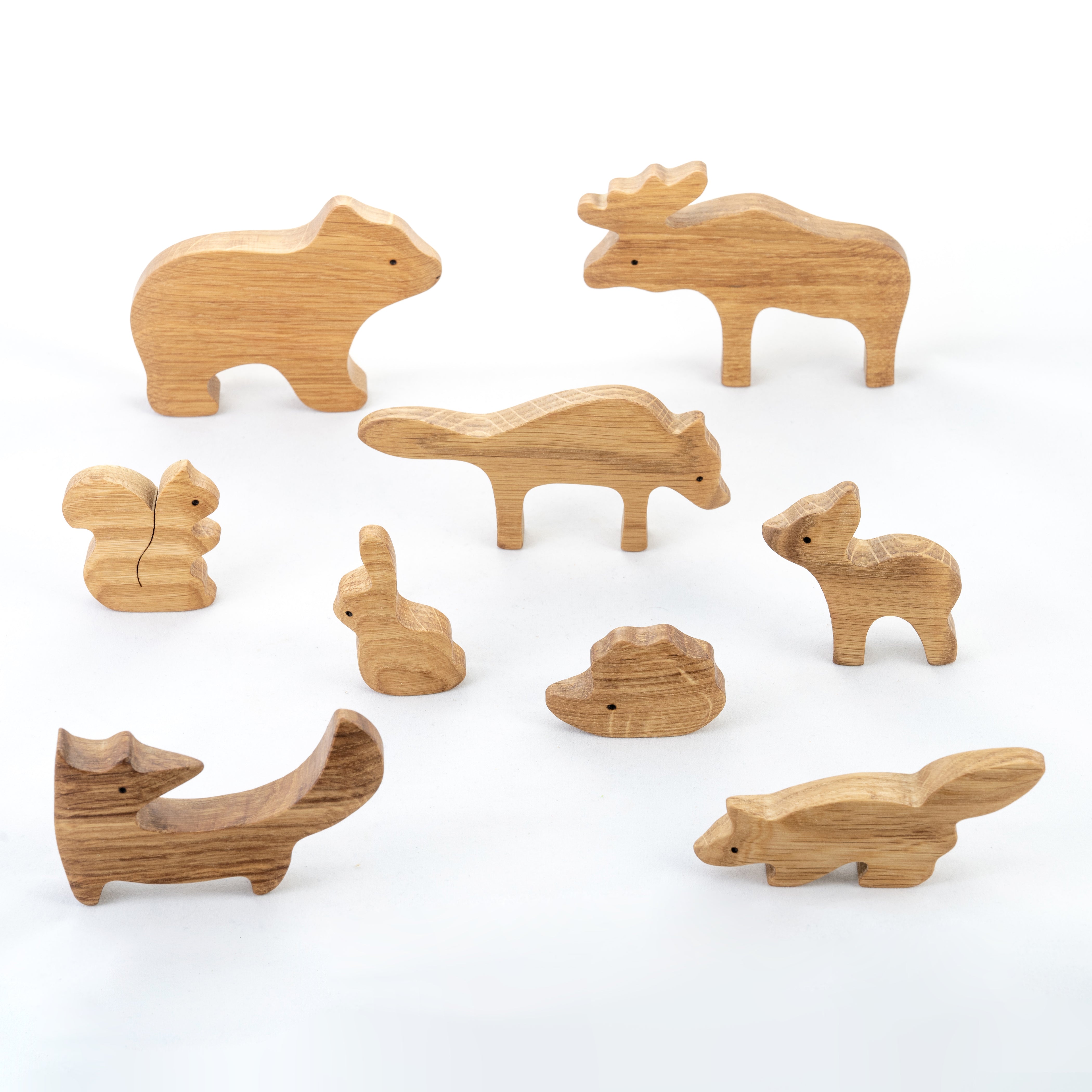 Set of wooden animal toys on a white background