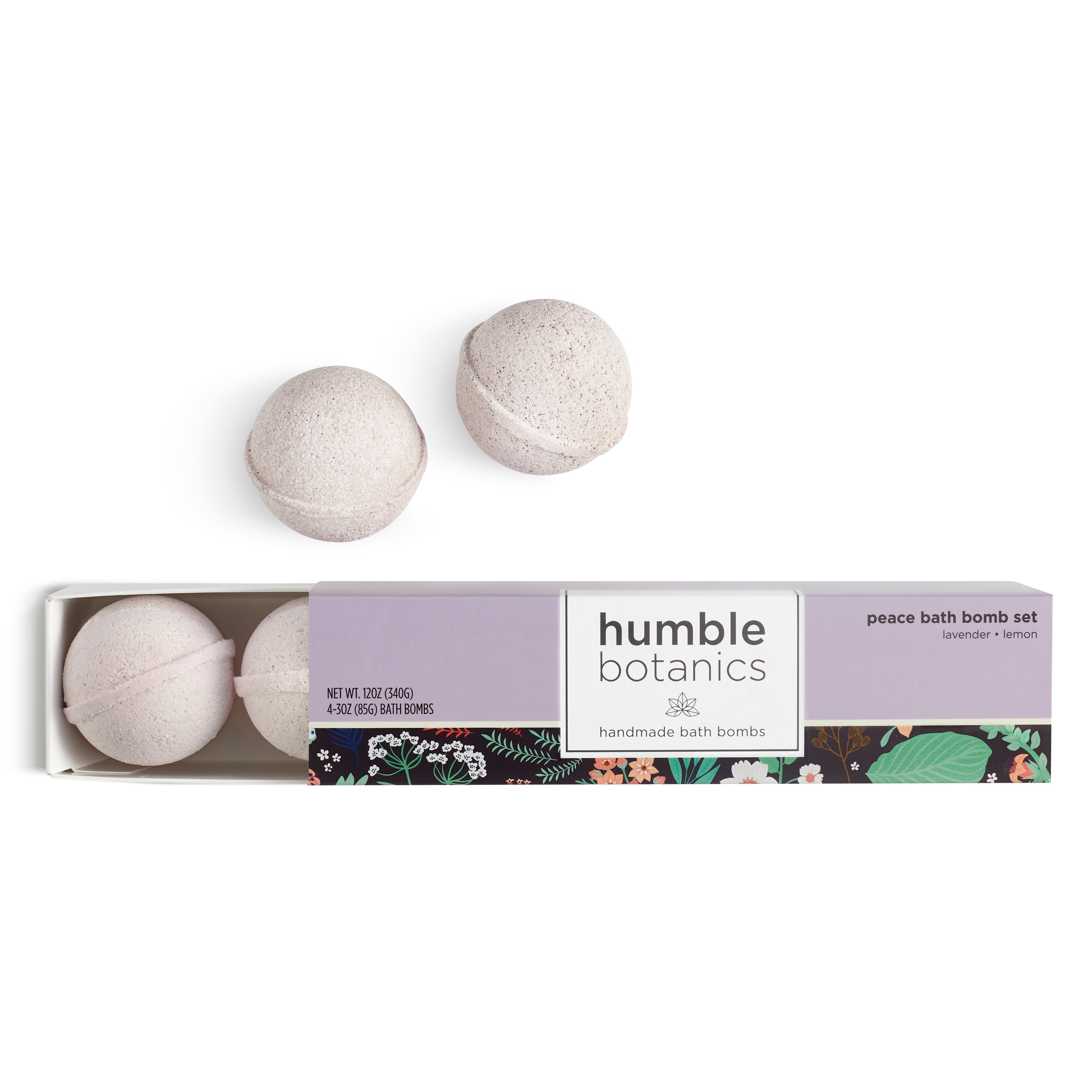 Three bath bombs in a box with 'humble botanics' branding on a white background