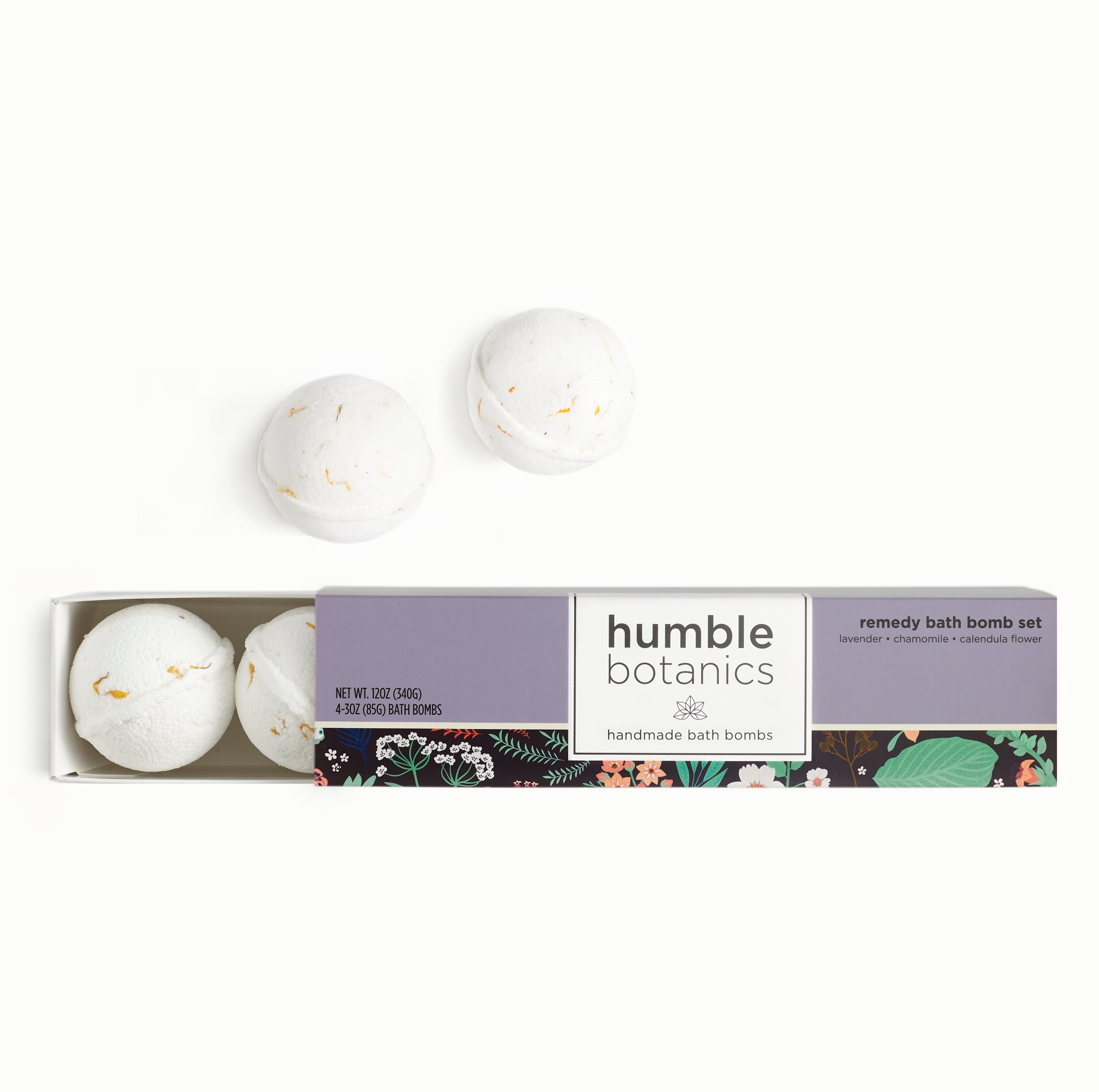 Set of bath bombs with 'humble botanics' packaging on a white background