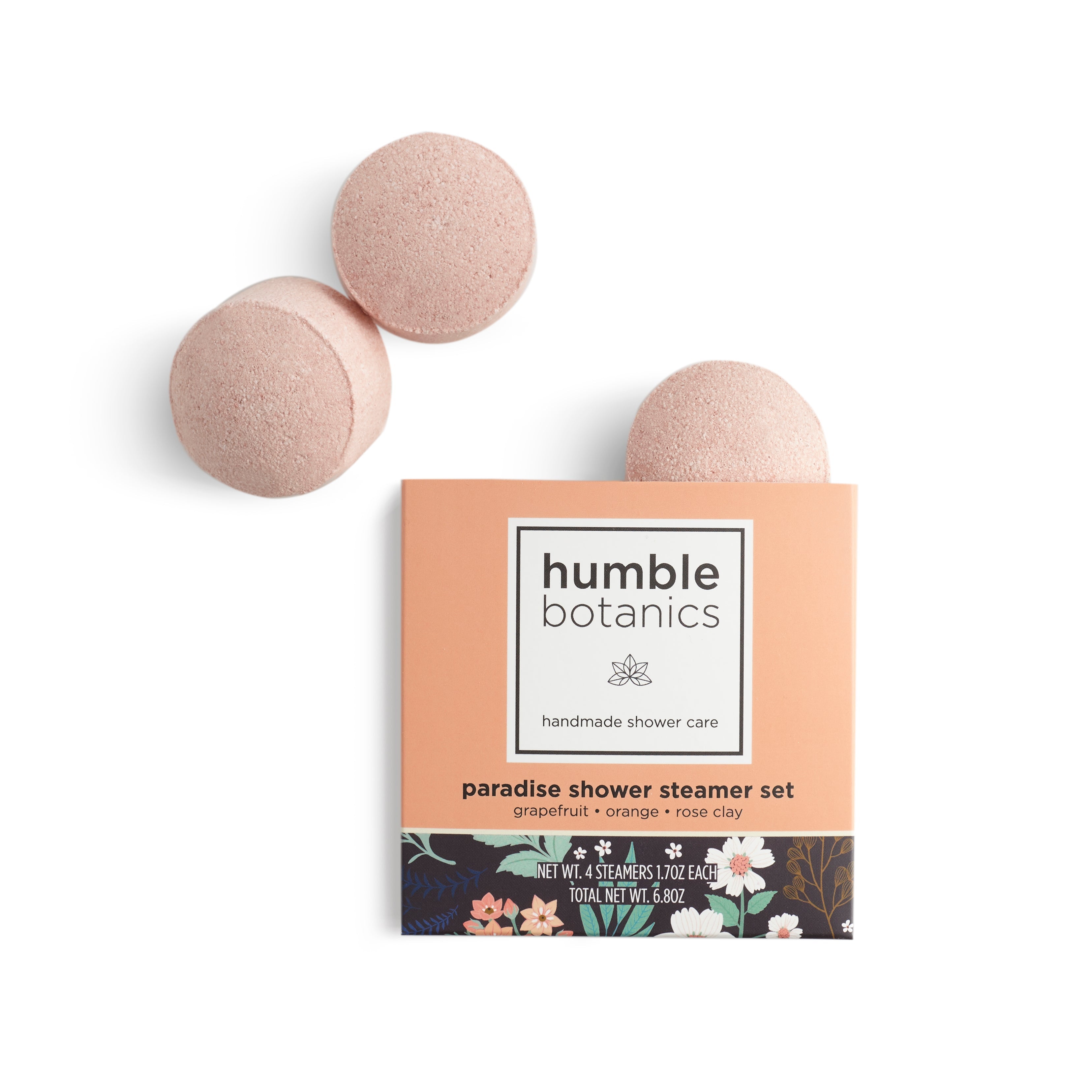 Two pink shower steamers with their packaging labeled 'humble botanics' on a white background.