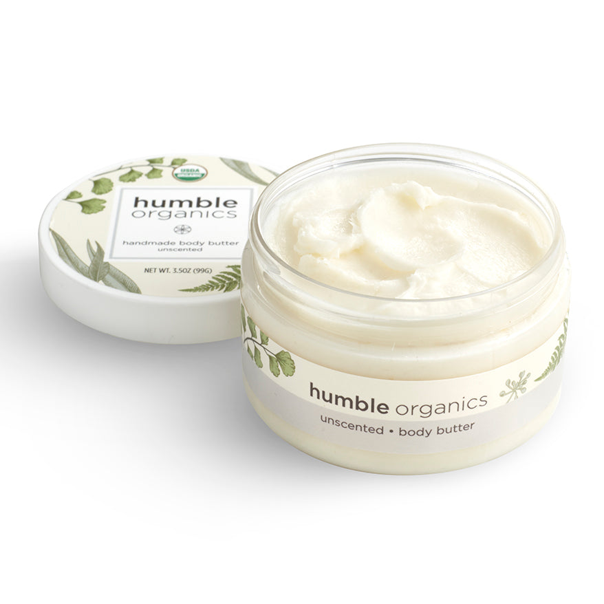 Humble Organics body butter jar with lid on a white background