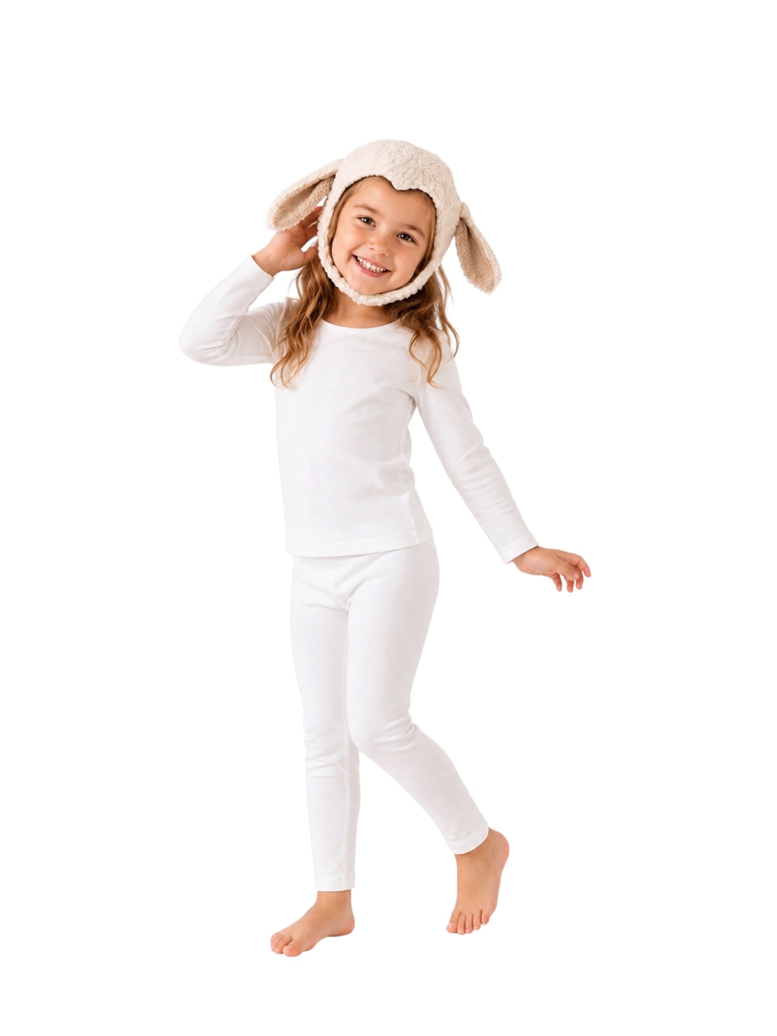 A young girl modeling a white long-sleeve top and matching white leggings, wearing a cream-colored plush bunny hood with floppy ears, against a solid white background.