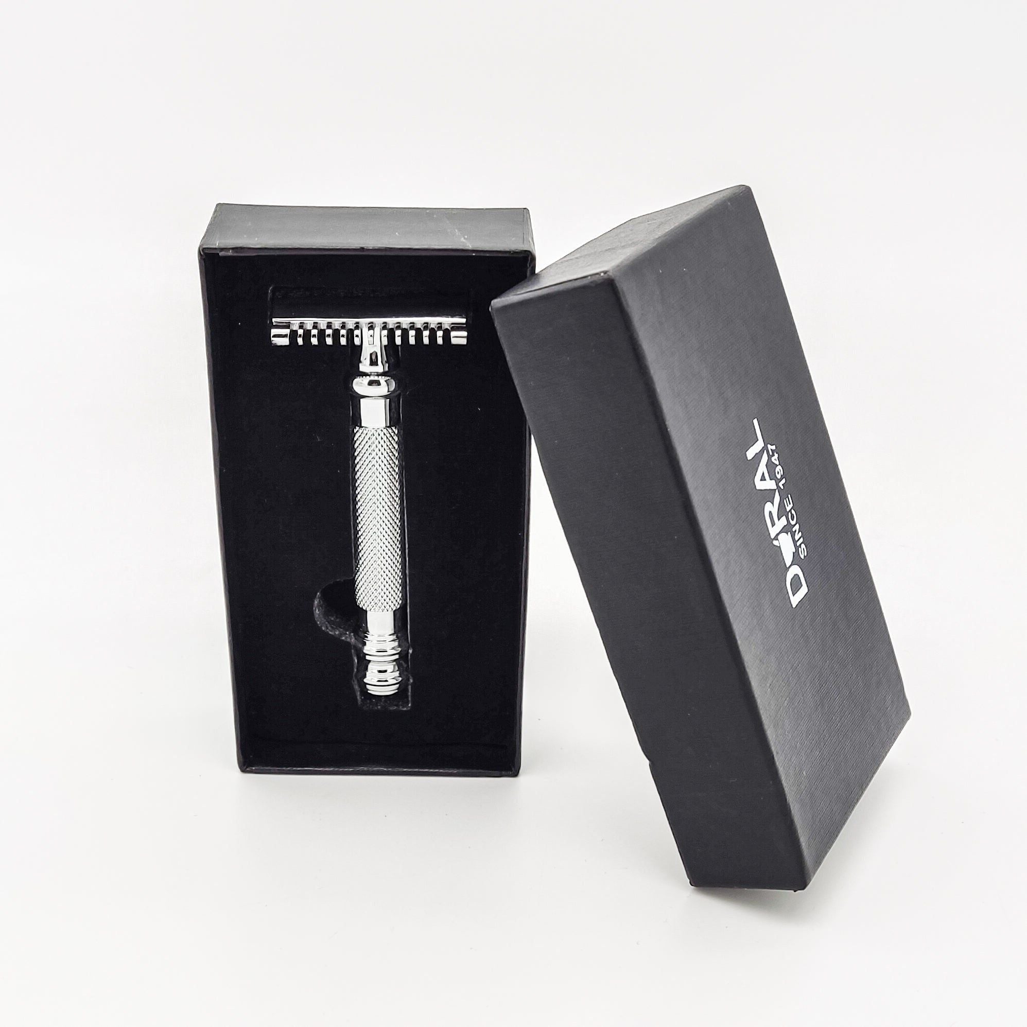 Silver safety razor in an open black box with 'DURAY' branding on a white background