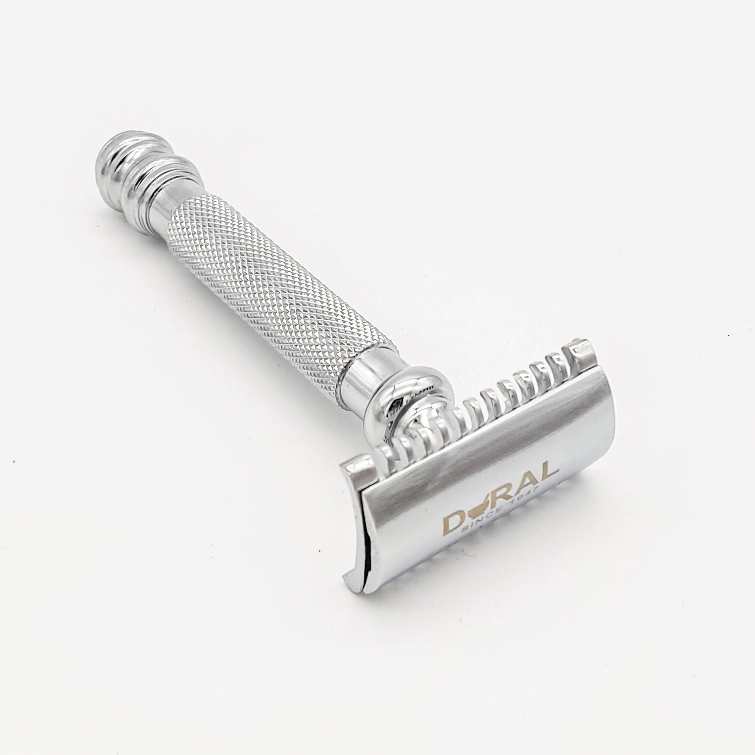 Silver safety razor on a white background