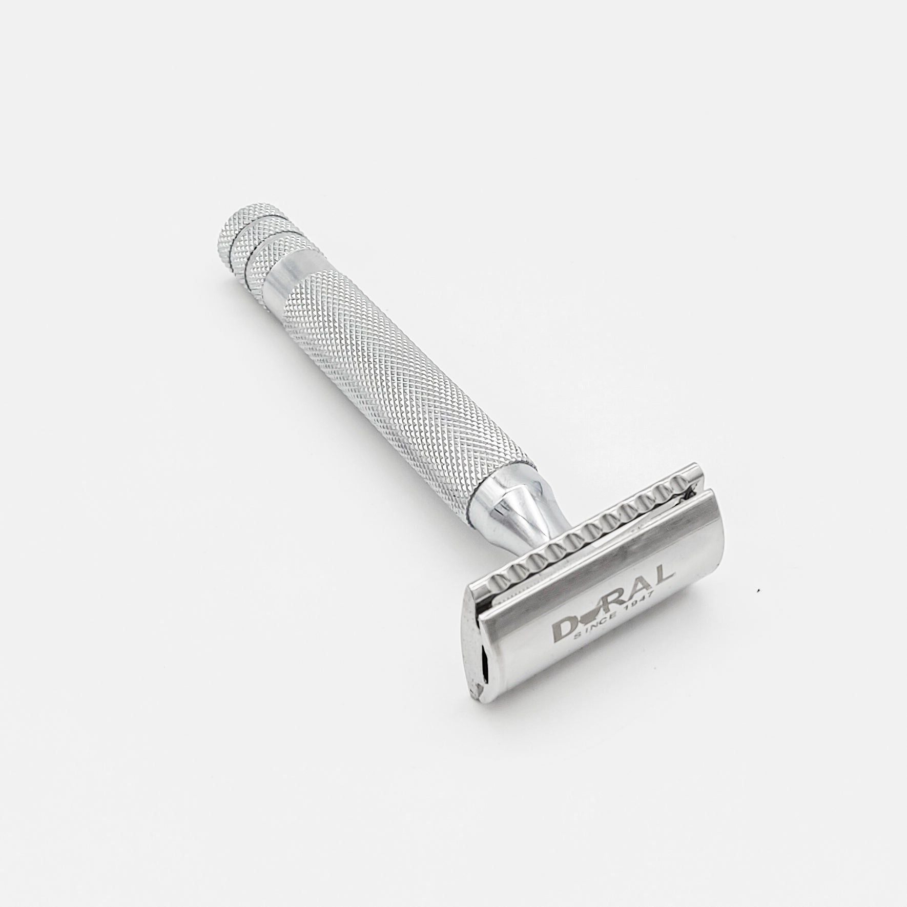 Silver safety razor on a white background