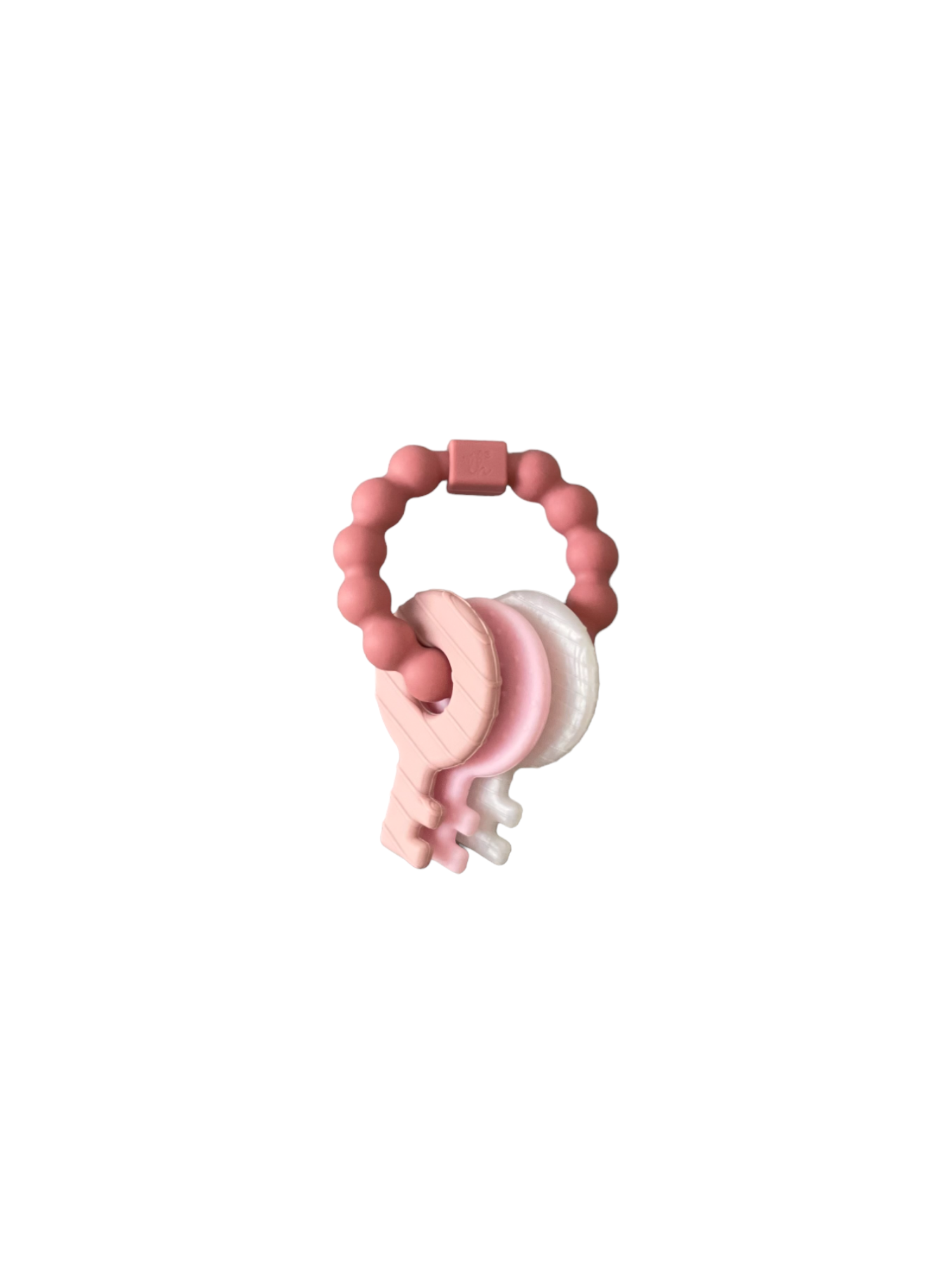 Pink and white baby teether on a white background