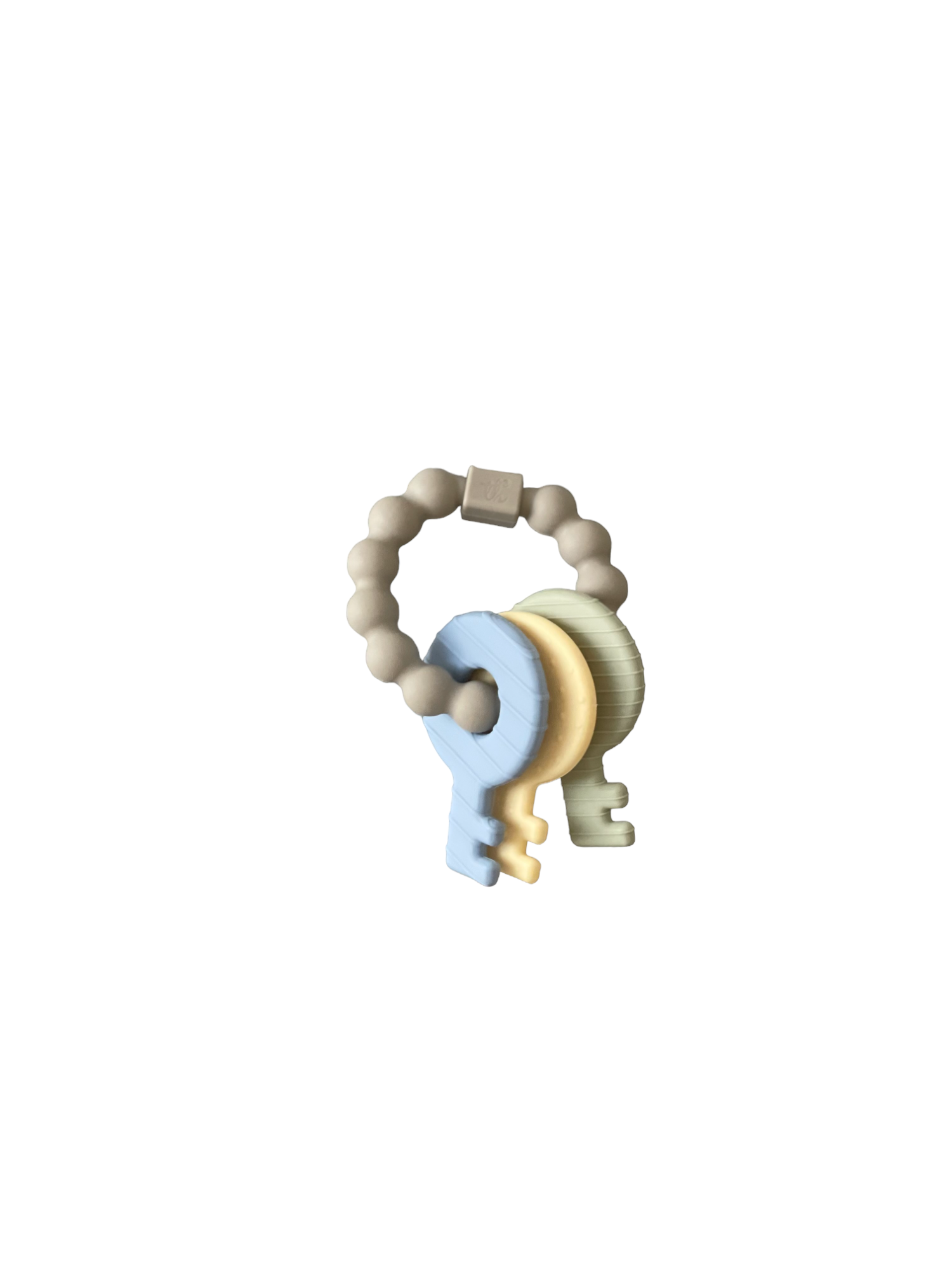 Teething ring with pastel colors on a white background