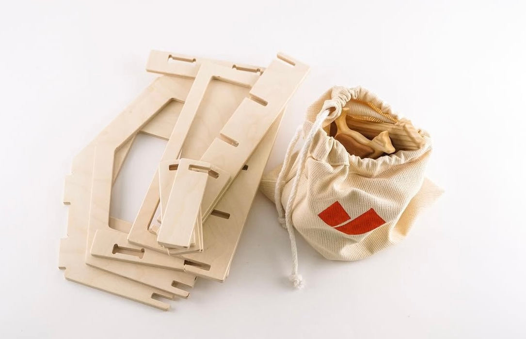 Wooden frames and a drawstring bag with wooden pieces on a white background