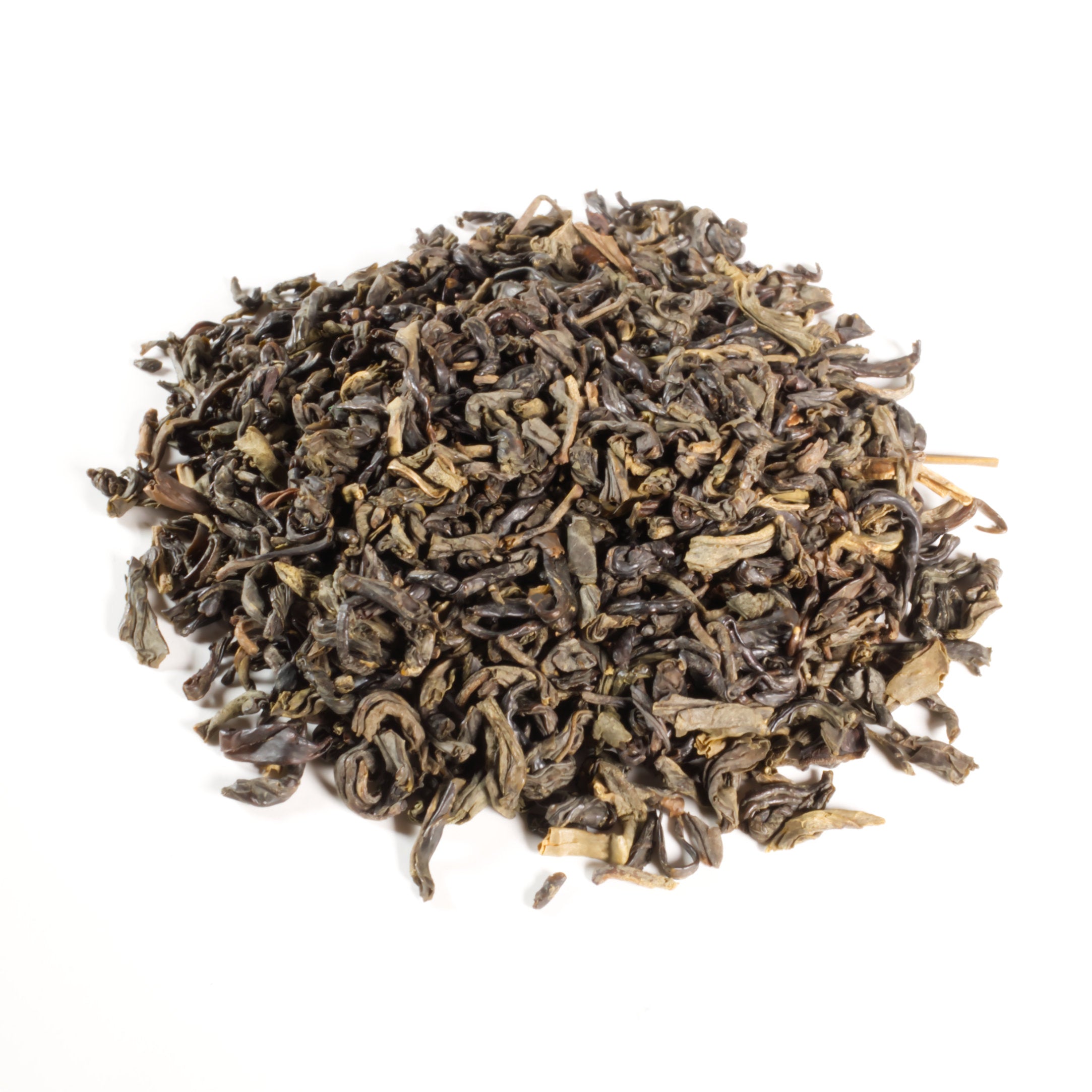 Dry black tea leaves on a white background