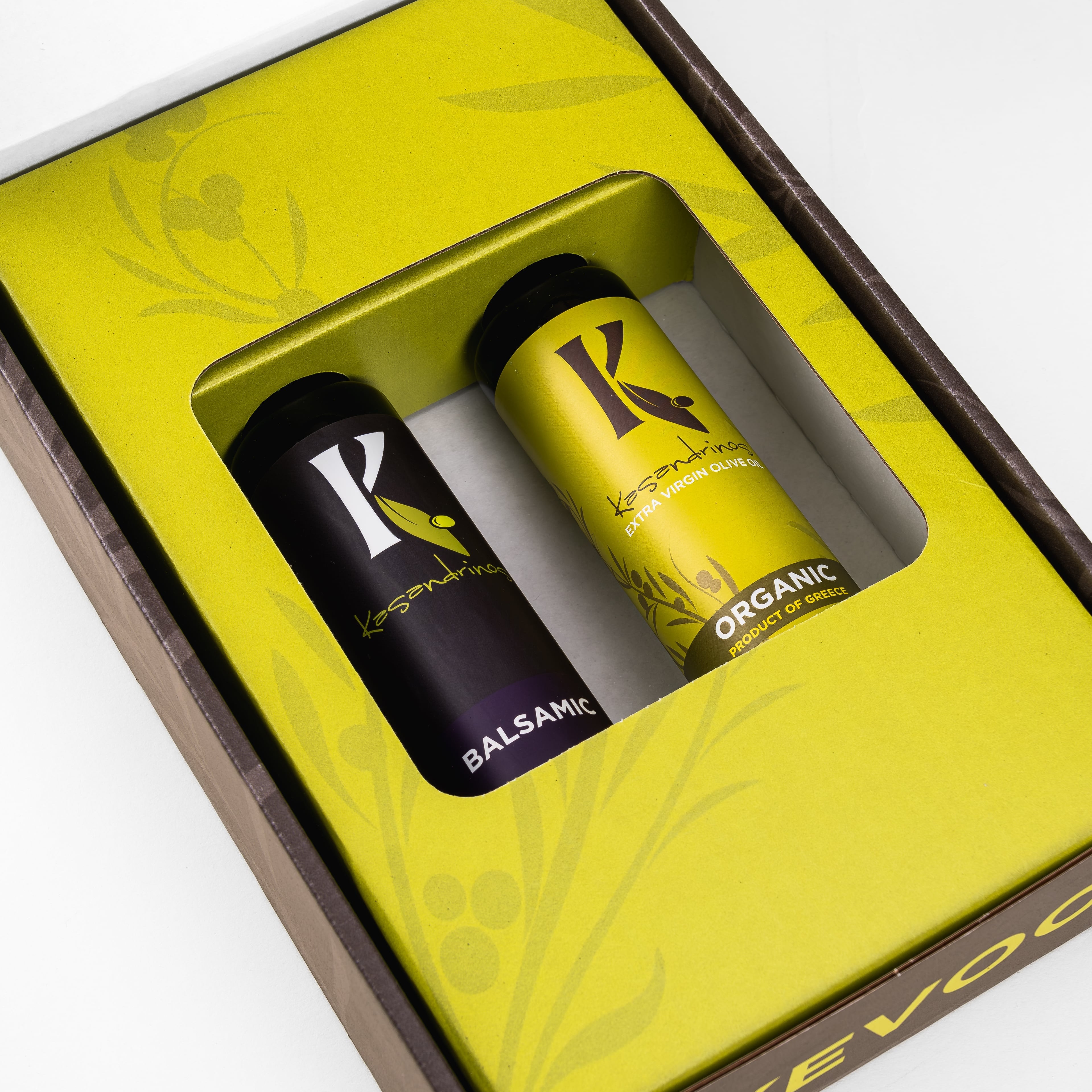 Two bottles of Kevorkian Organic products in a decorative box with a yellow interior.