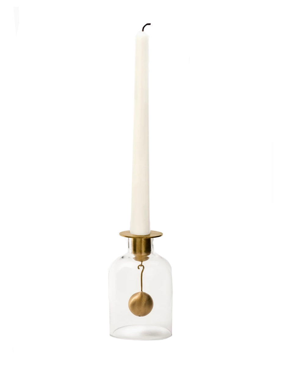 Candle holder with a white candle on a white background