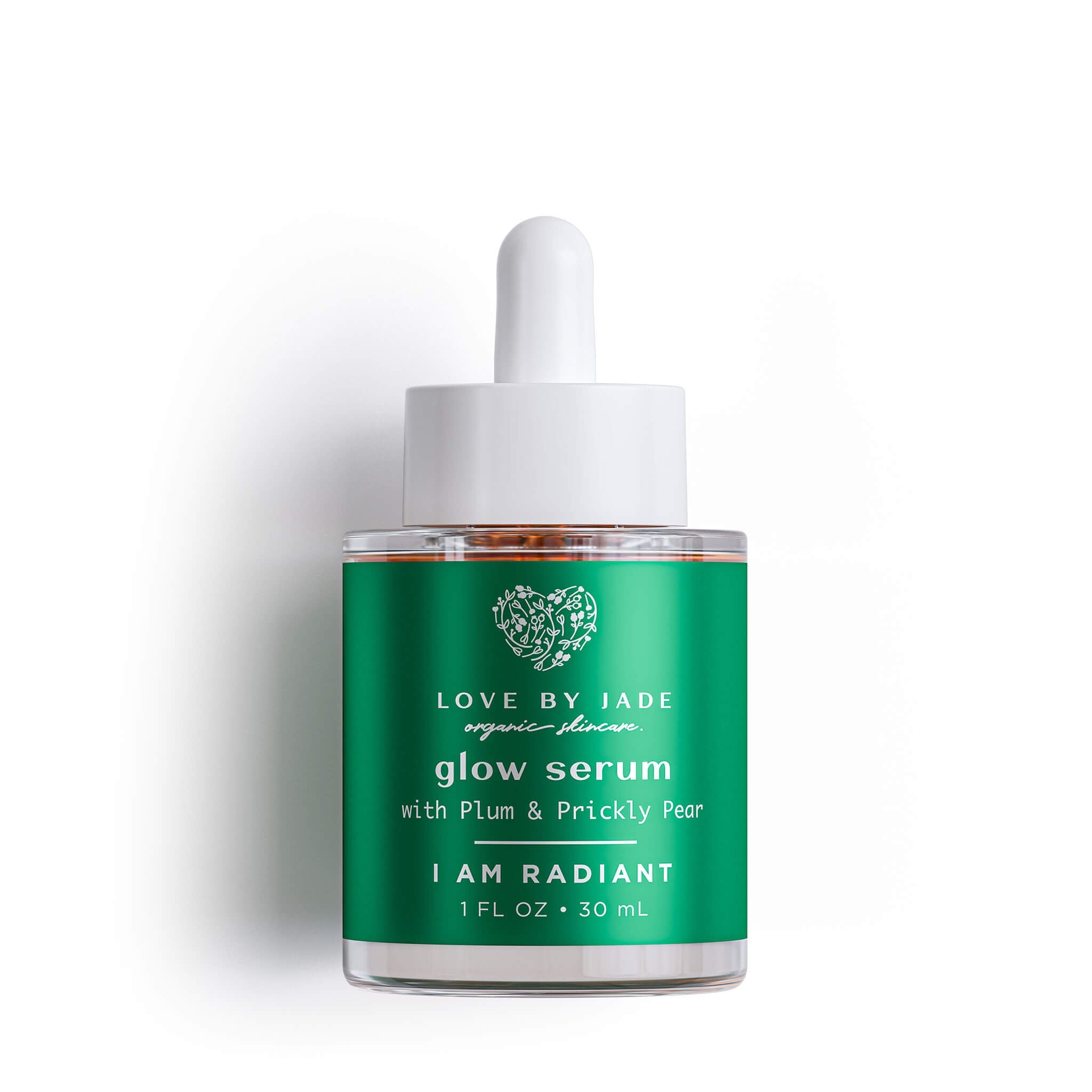Love by Jade glow serum bottle with green label on a white background