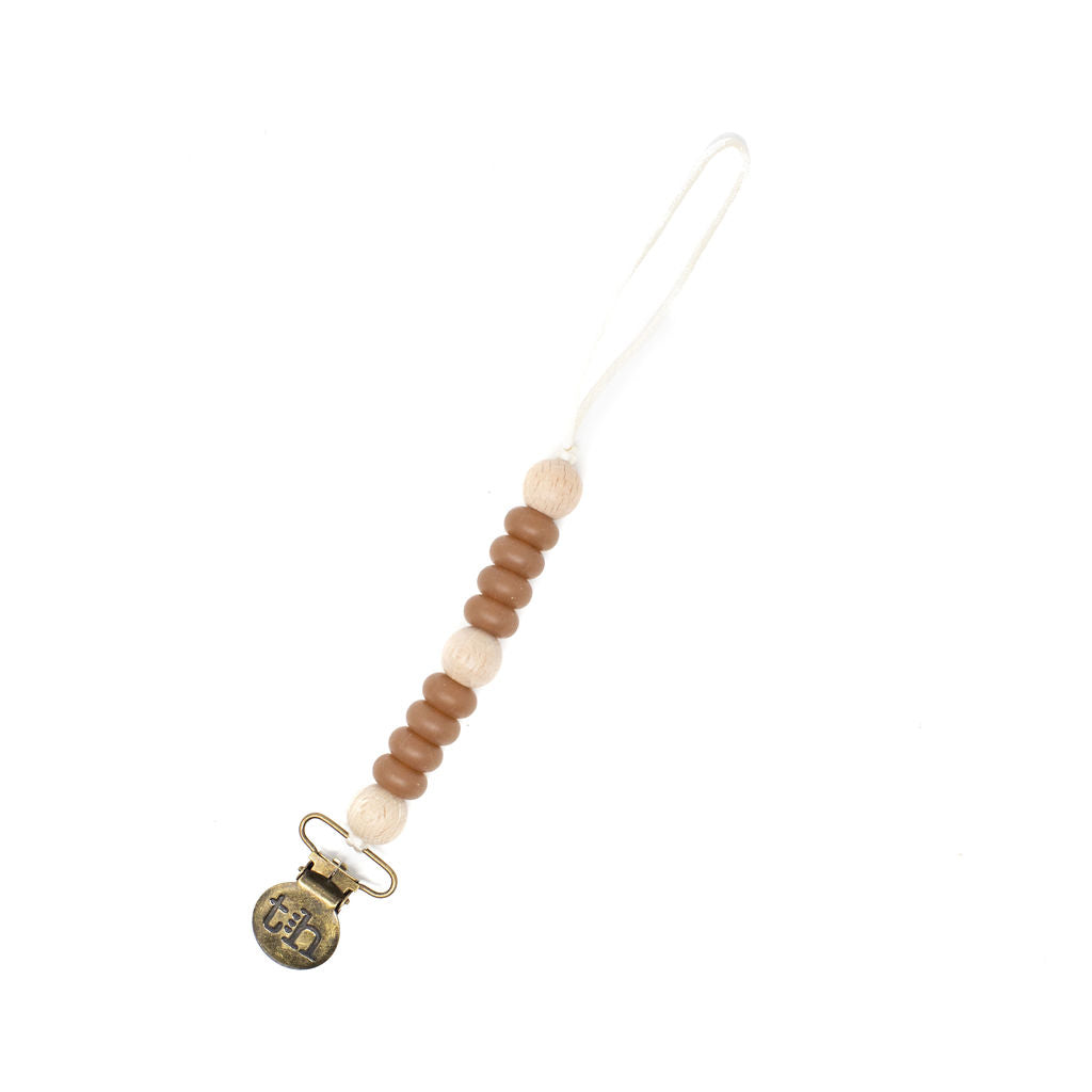 Beaded pacifier clip with a gold clasp on a white background