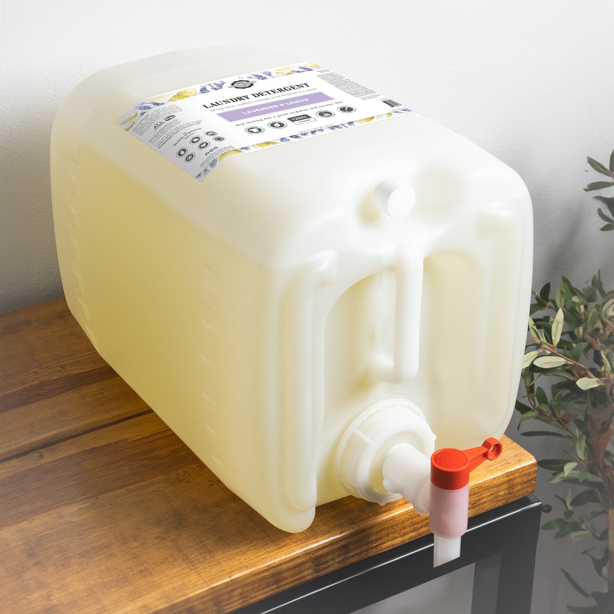 Large plastic container with a pump on a wooden surface