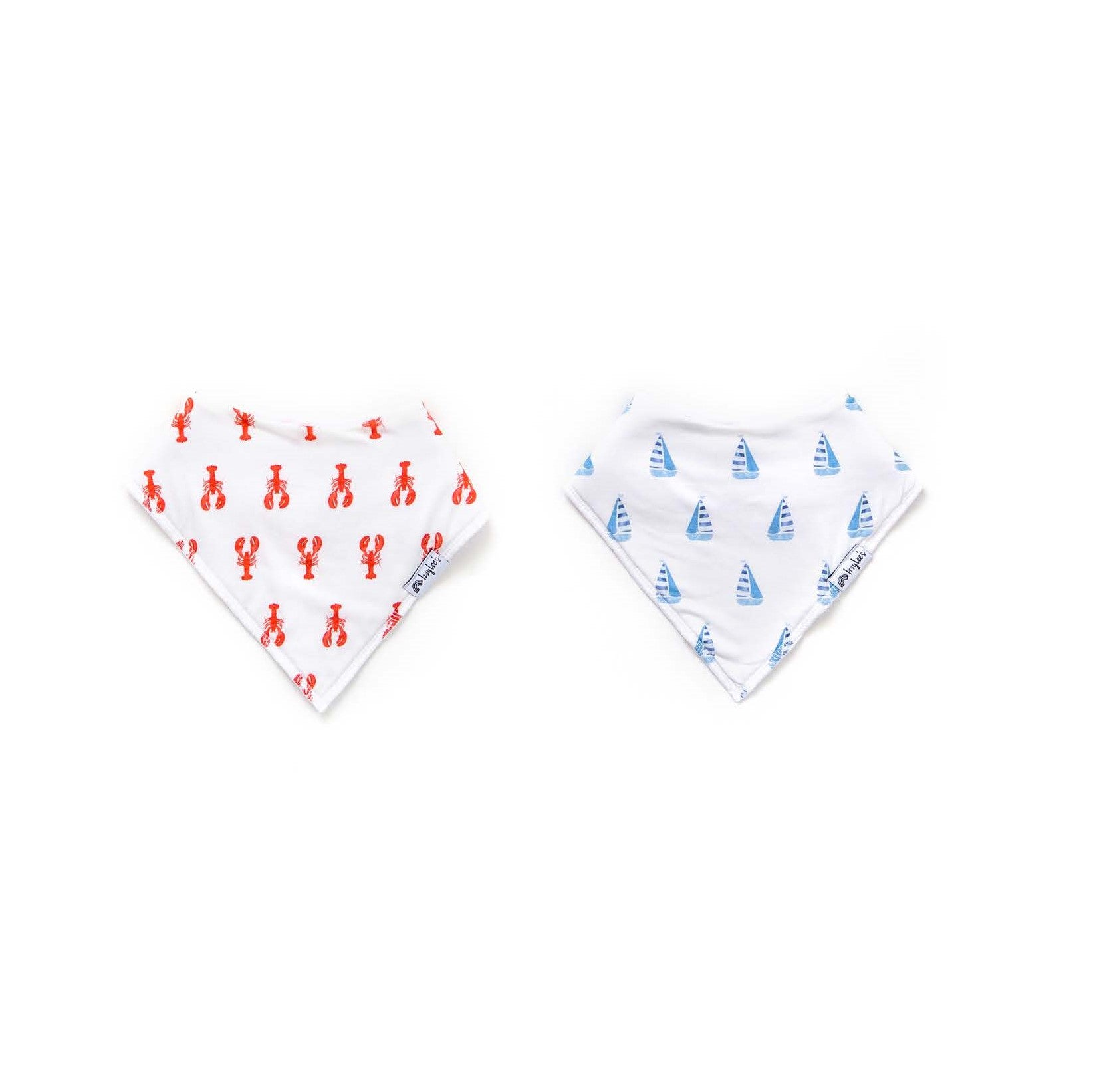 Two baby bibs with lobster and sailboat patterns on a white background
