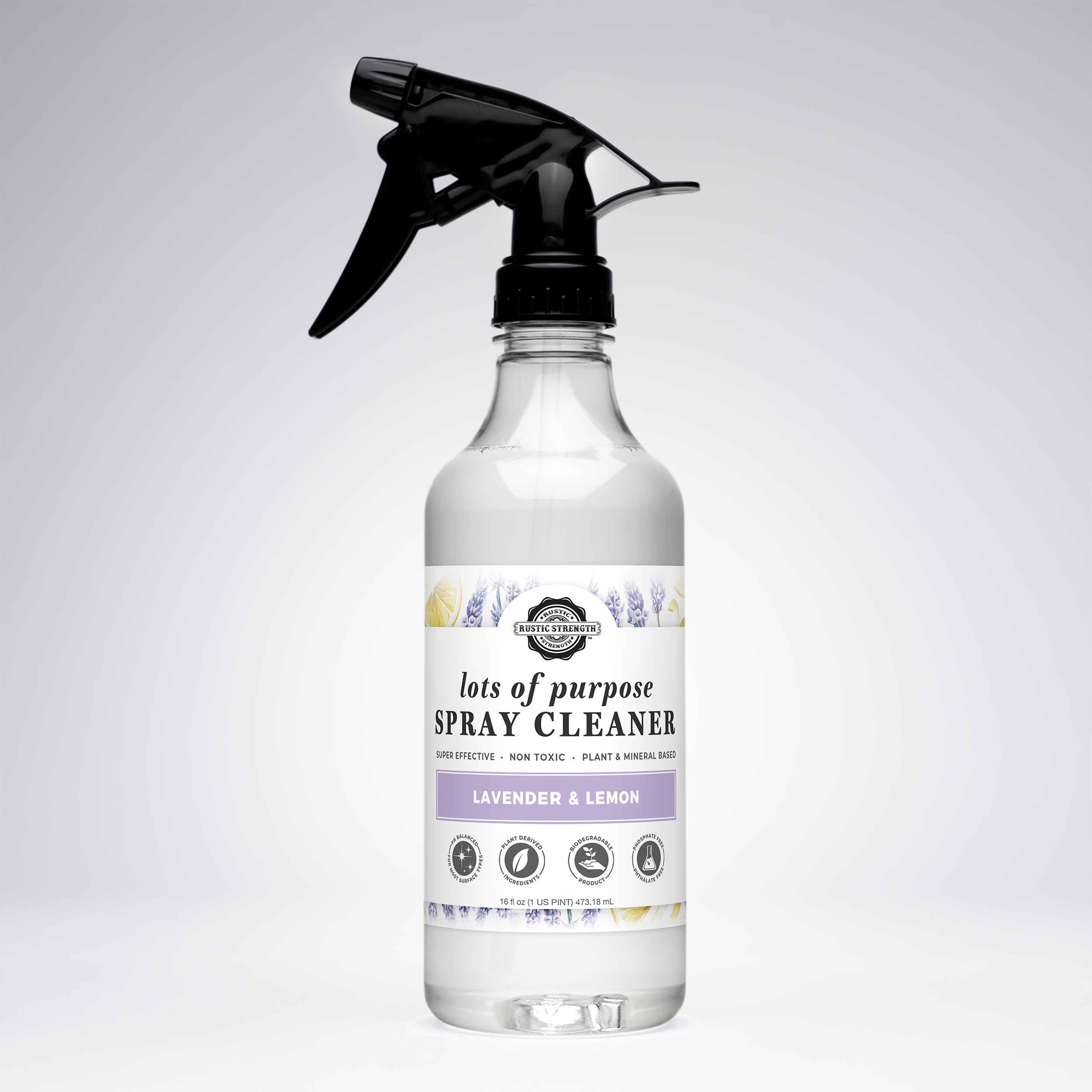 A clear plastic spray bottle of 'lots of purpose' brand Lavender & Lemon spray cleaner with a black trigger sprayer and a white label, set against a light gray gradient background.