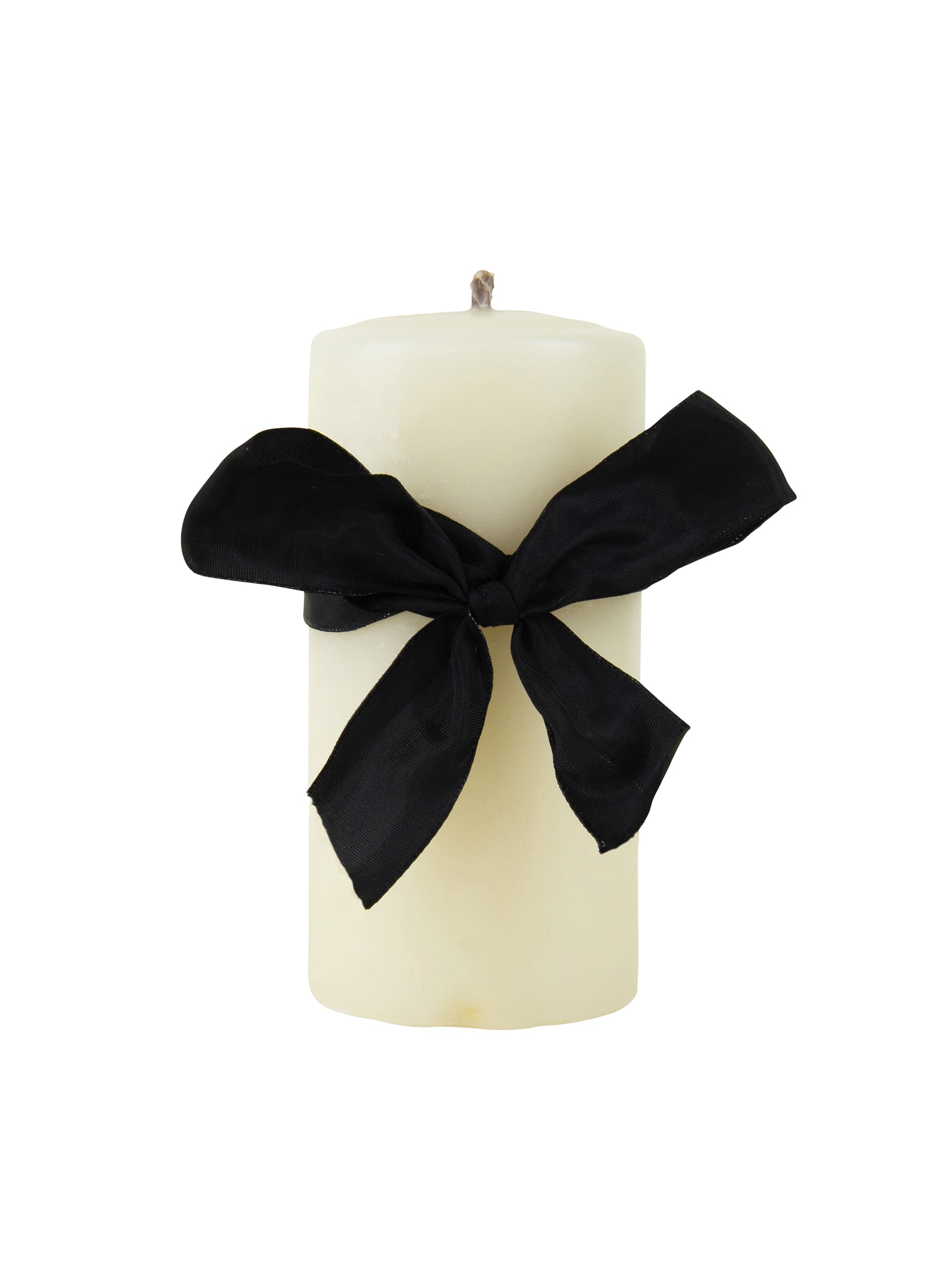 White candle with a black ribbon on a white background