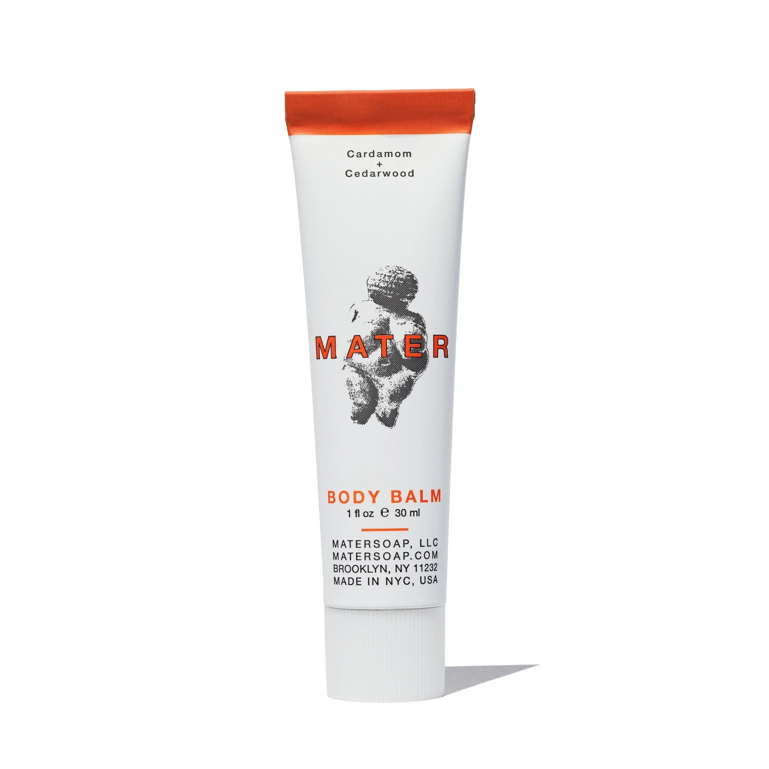Tube of Mater body balm on a white background